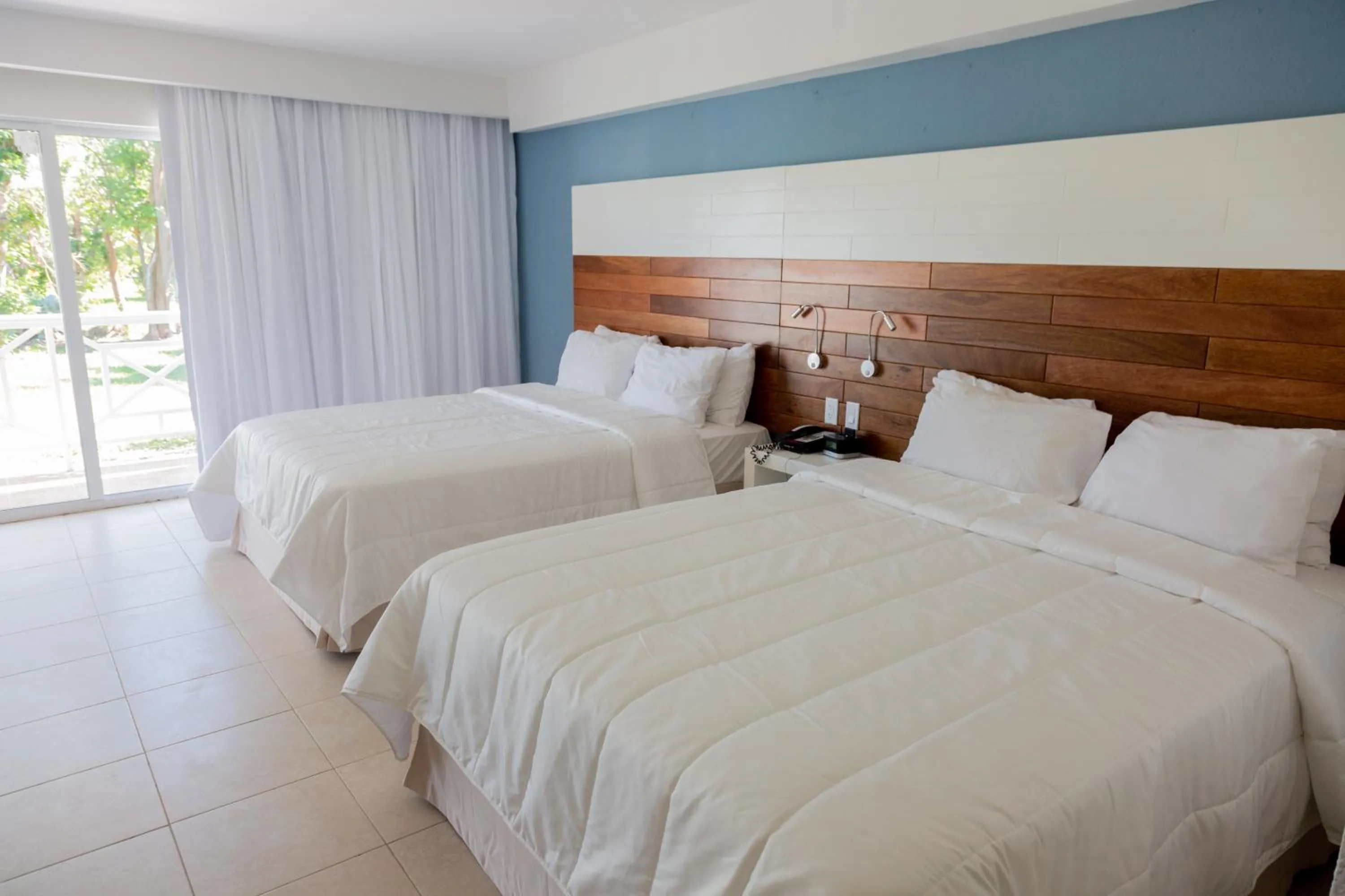 Bed in Viva Fortuna Beach by Wyndham, A Trademark All Inclusive