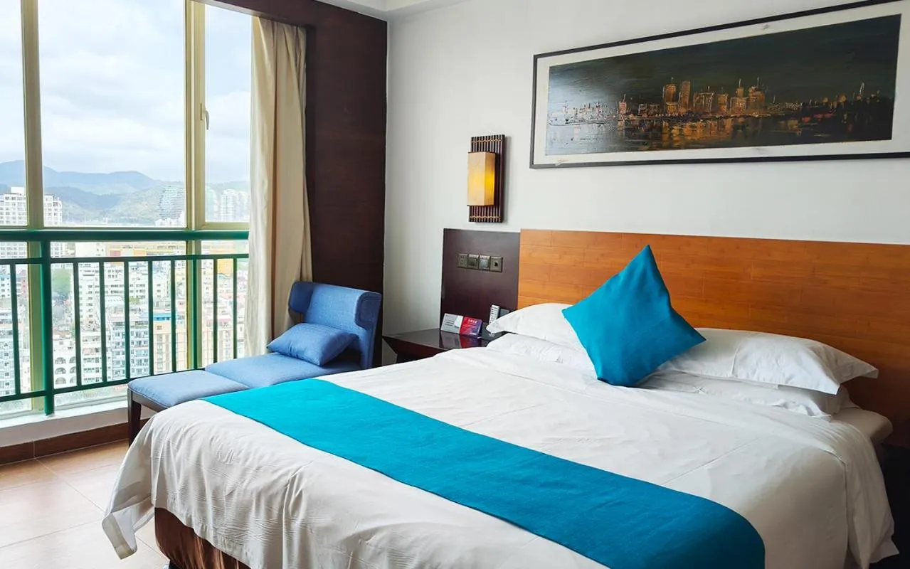 Bed in Shengyi Holiday Villa Hotel