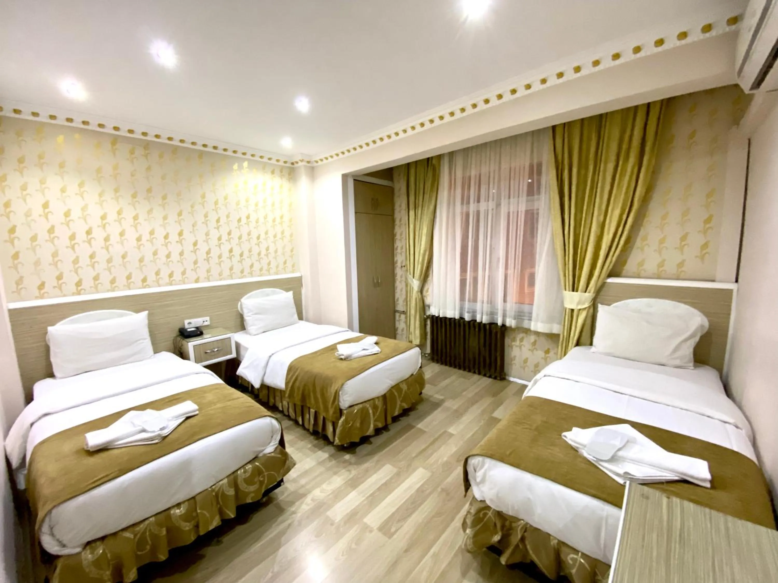 Bed in Grand Oral Hotel