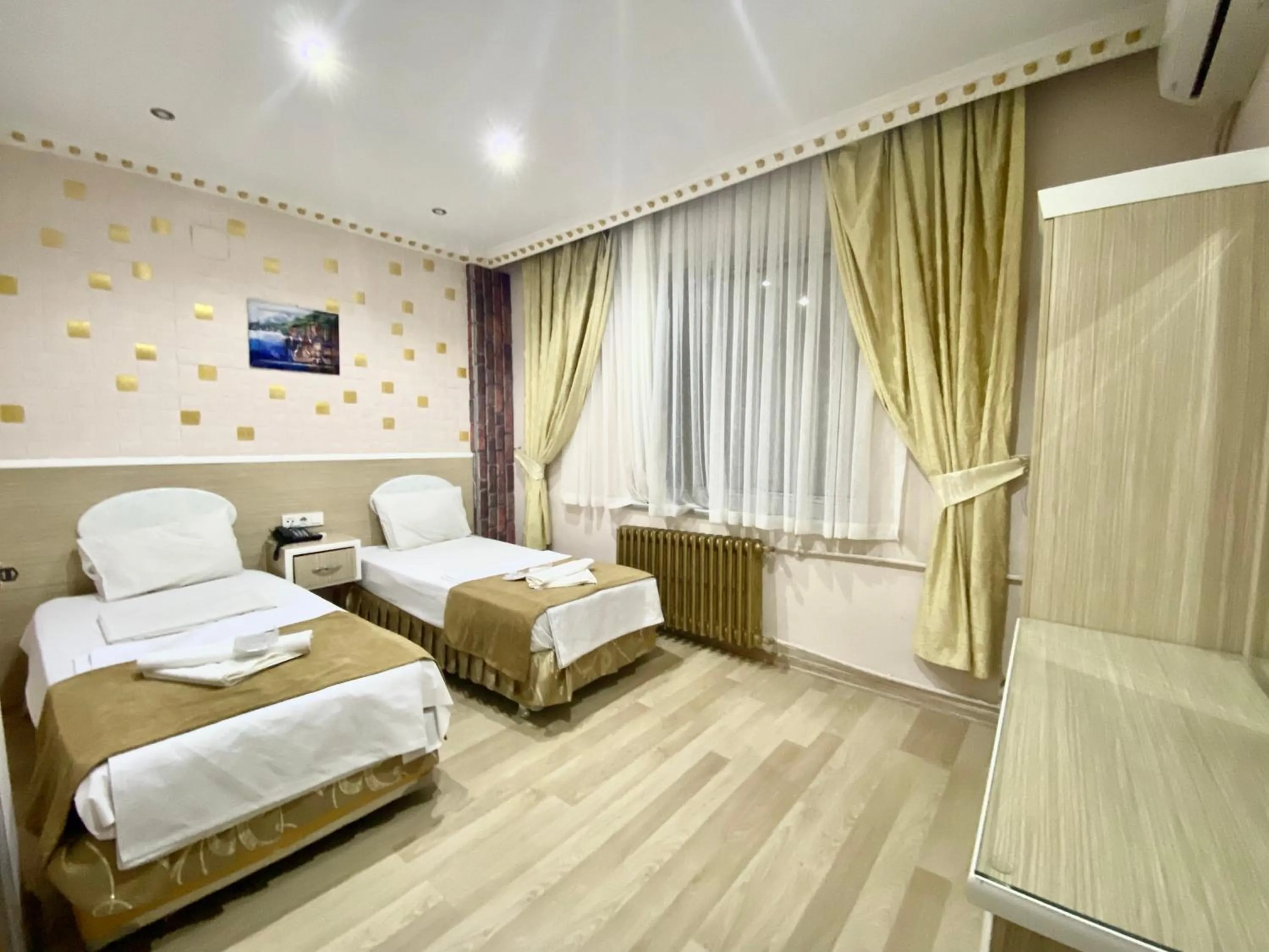 Bed in Grand Oral Hotel