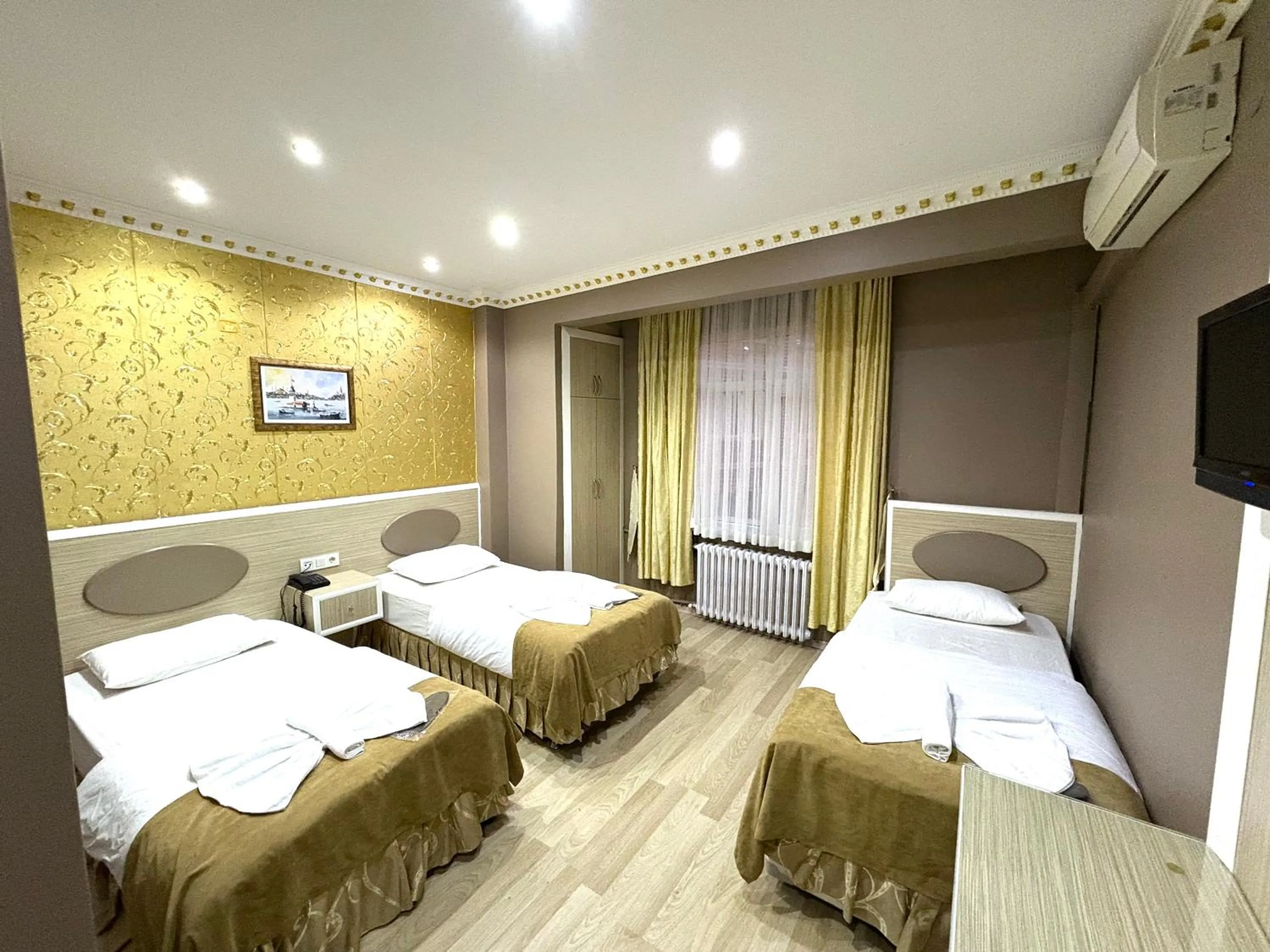 Bed in Grand Oral Hotel