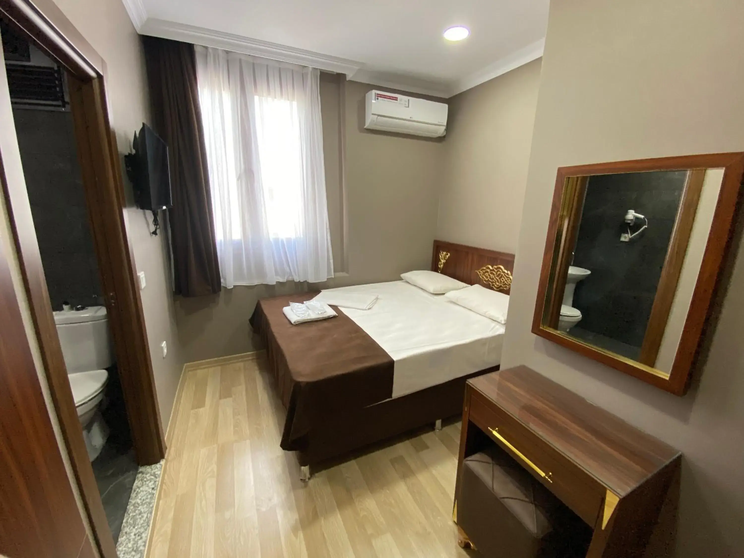 Bed in Grand Oral Hotel Bed in Grand Oral Hotel