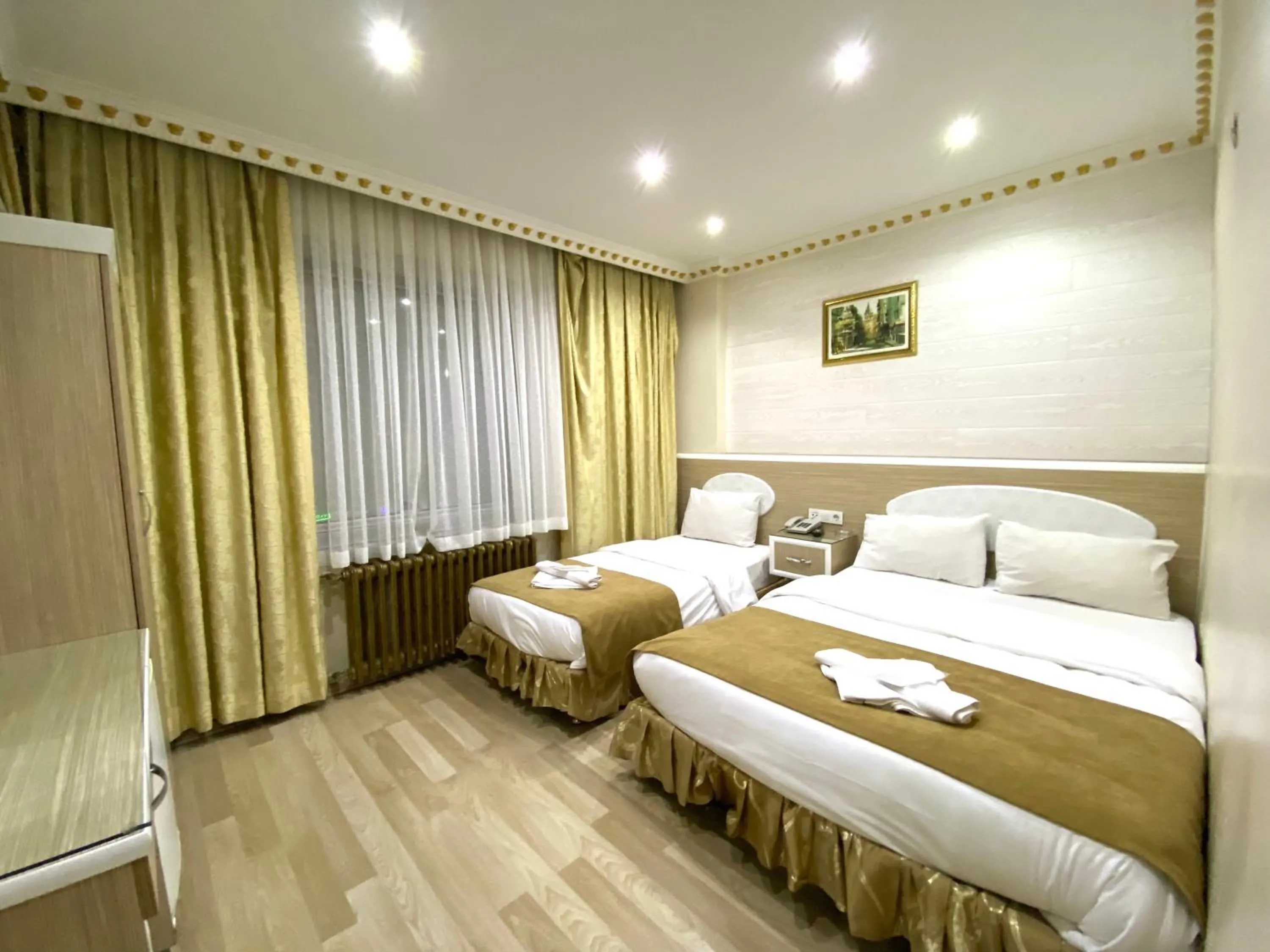 Bed in Grand Oral Hotel