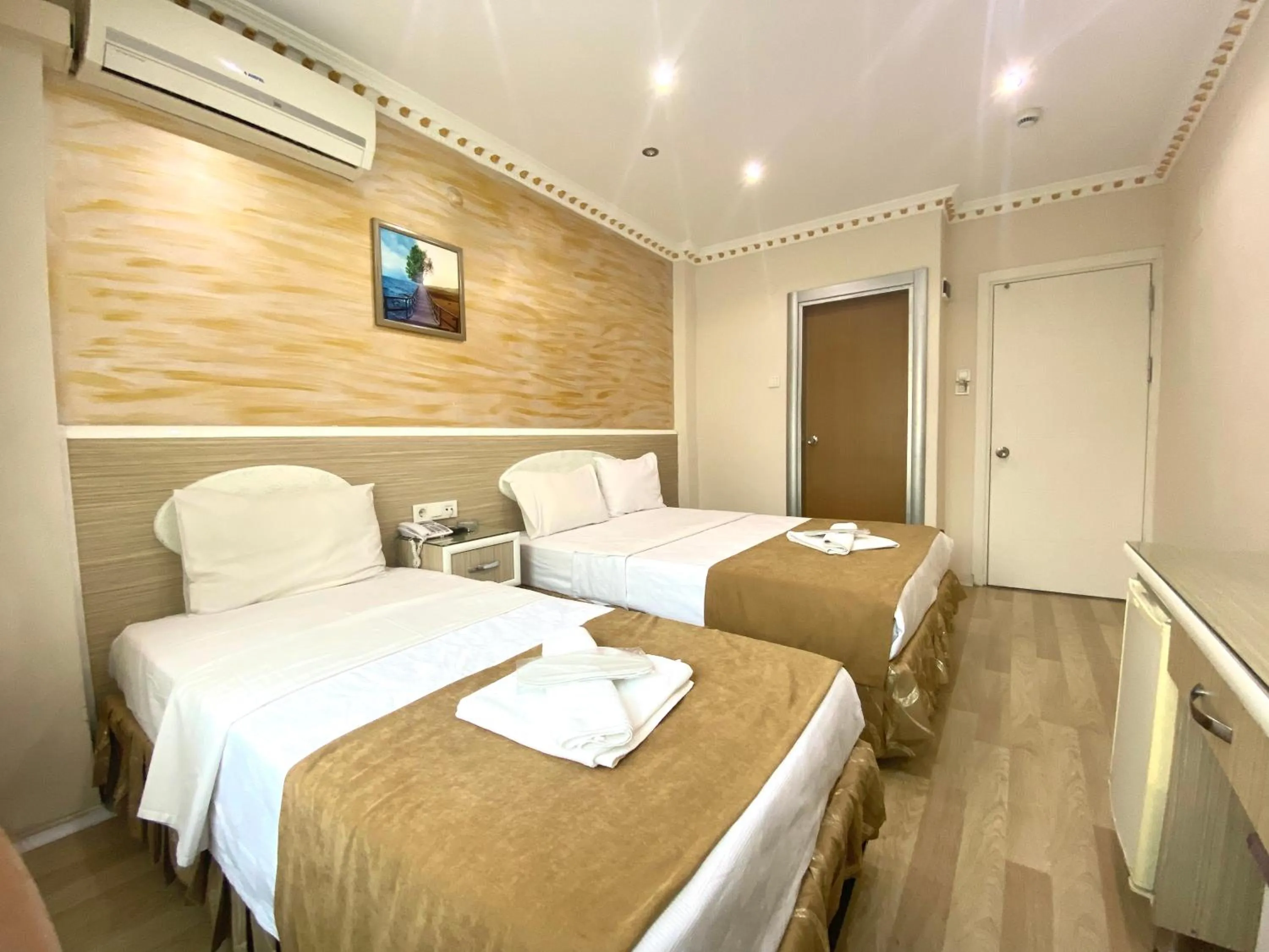 Bed in Grand Oral Hotel