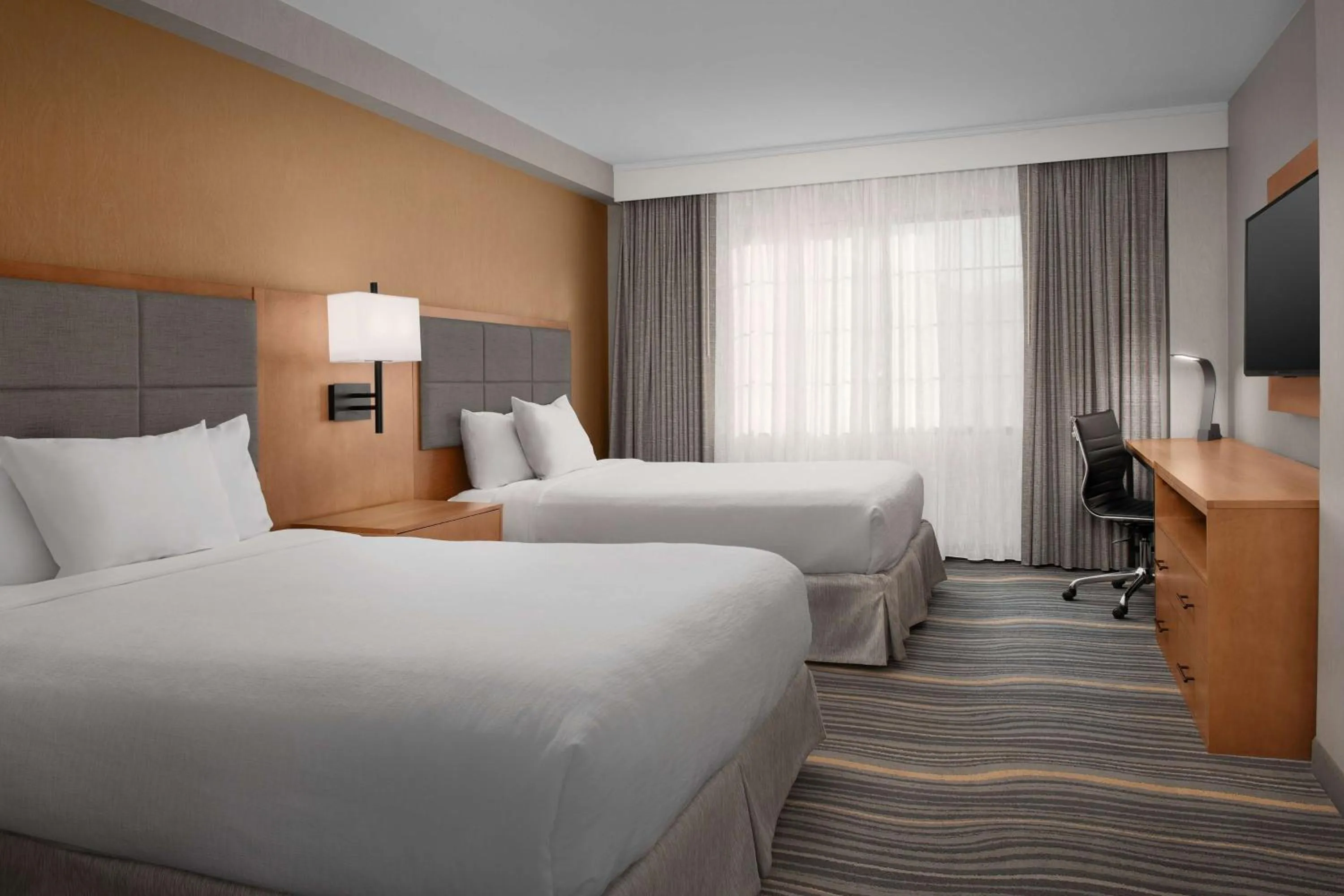 Bed in Embassy Suites La Quinta Hotel & Spa