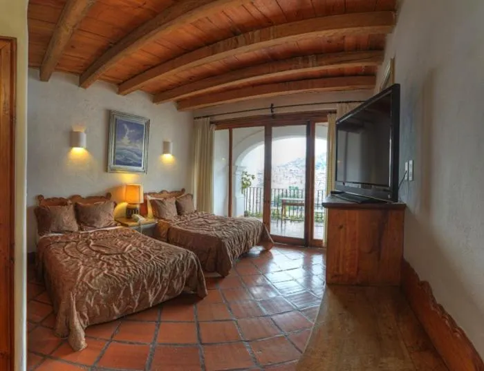Balcony/Terrace, Bed in Posada de la Mision, Hotel Museo y Jardin