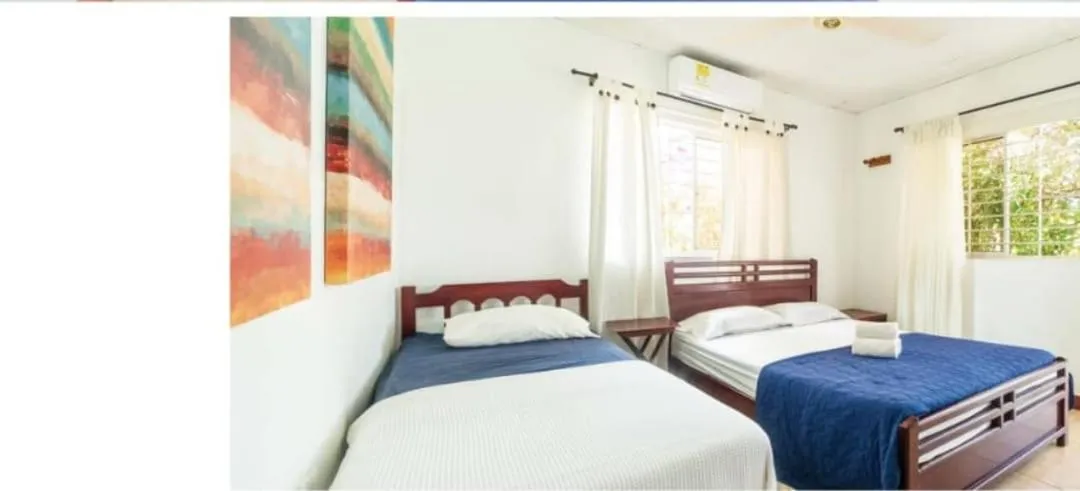 Photo of the whole room, Bed in Hostal del Mar - Tolu