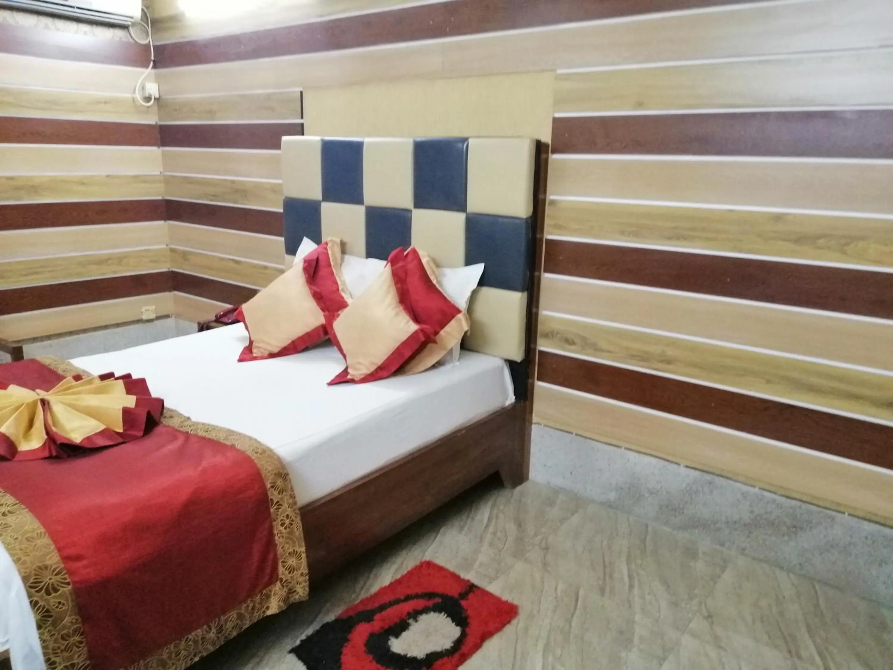 Bed in Tiger Garden Int Hotel