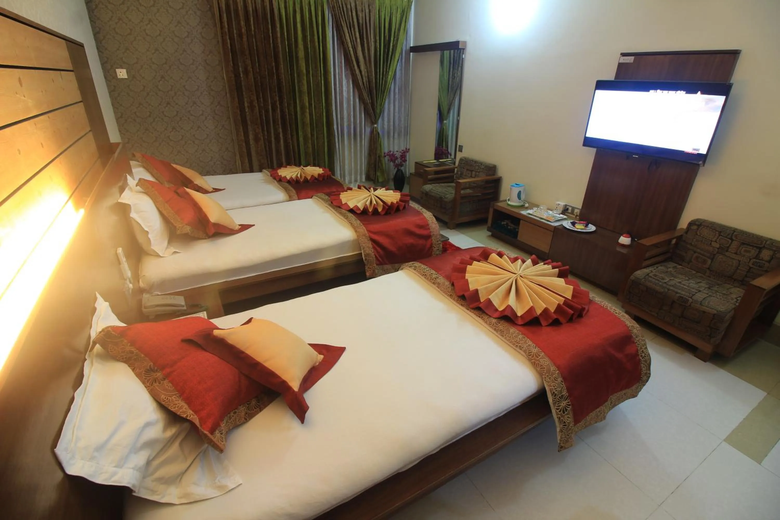 Bed in Tiger Garden Int Hotel