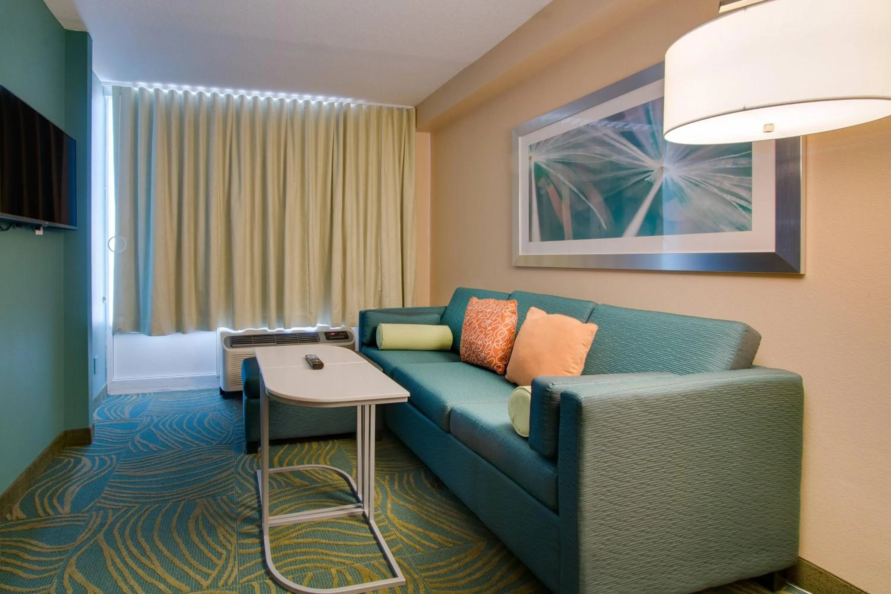 Living room in SpringHill Suites by Marriott Orlando Lake Buena Vista South