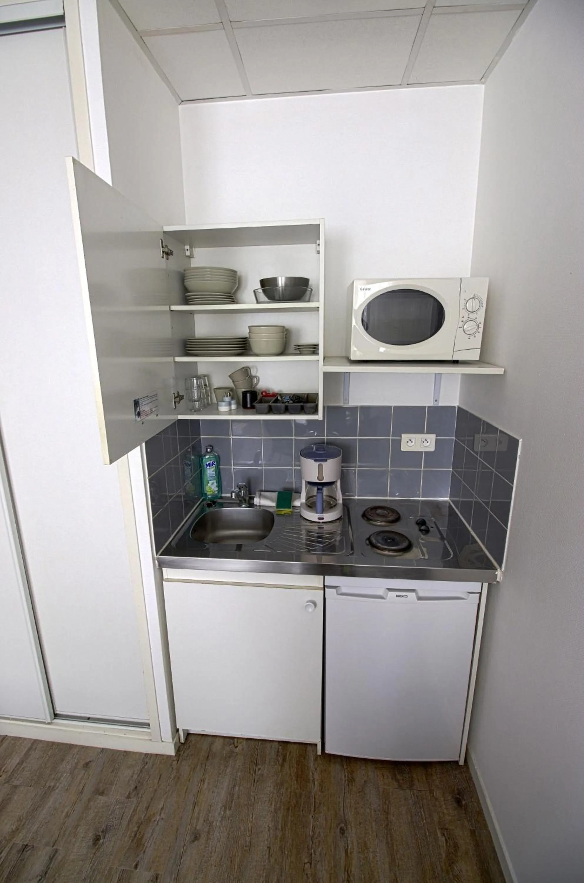 Kitchen or kitchenette in KOSY Appart'Hôtels - Le Cours Moreau
