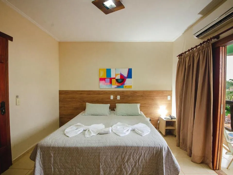 Bed in Pousada Chamamé