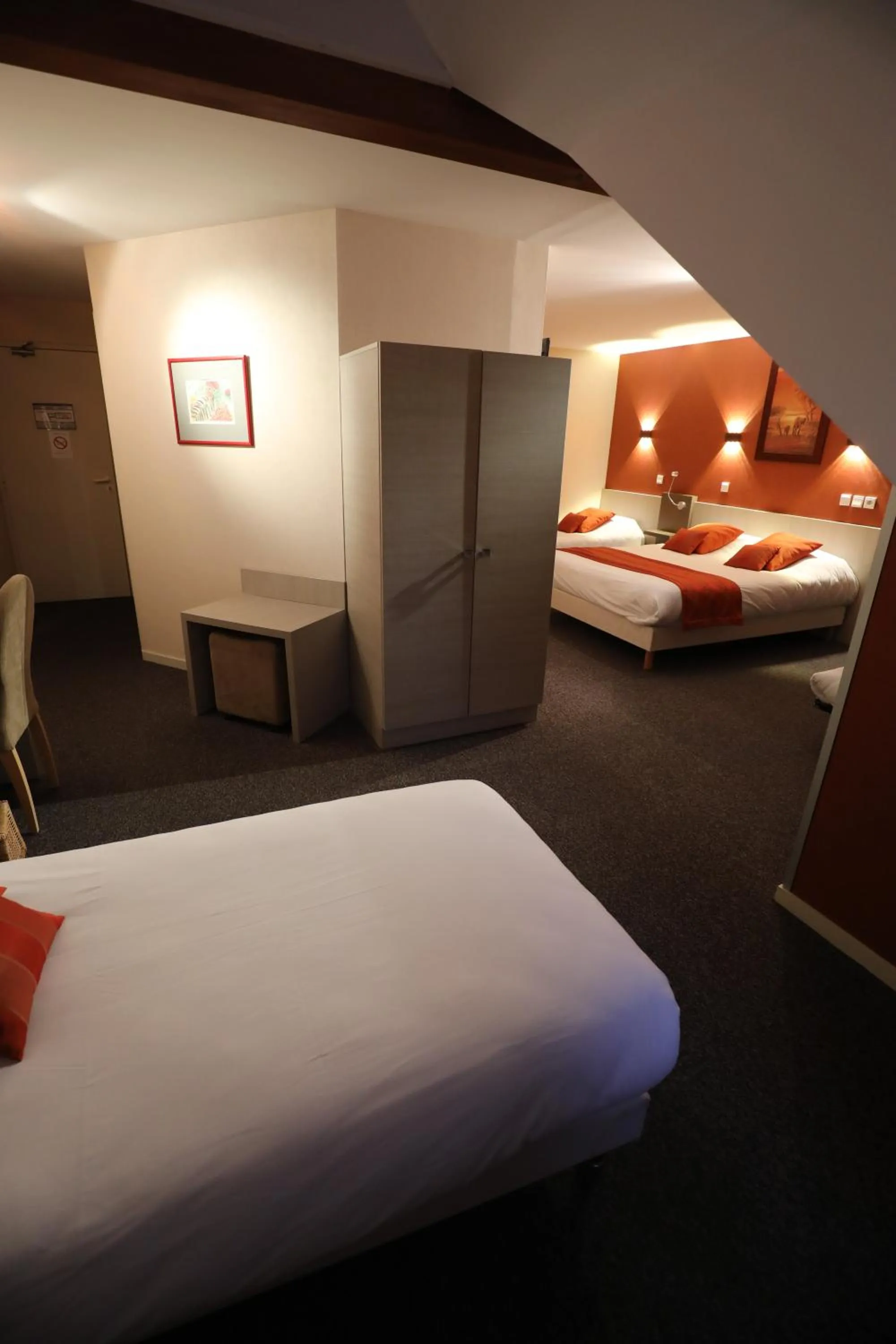 Bed in Logis Le Bourguignon