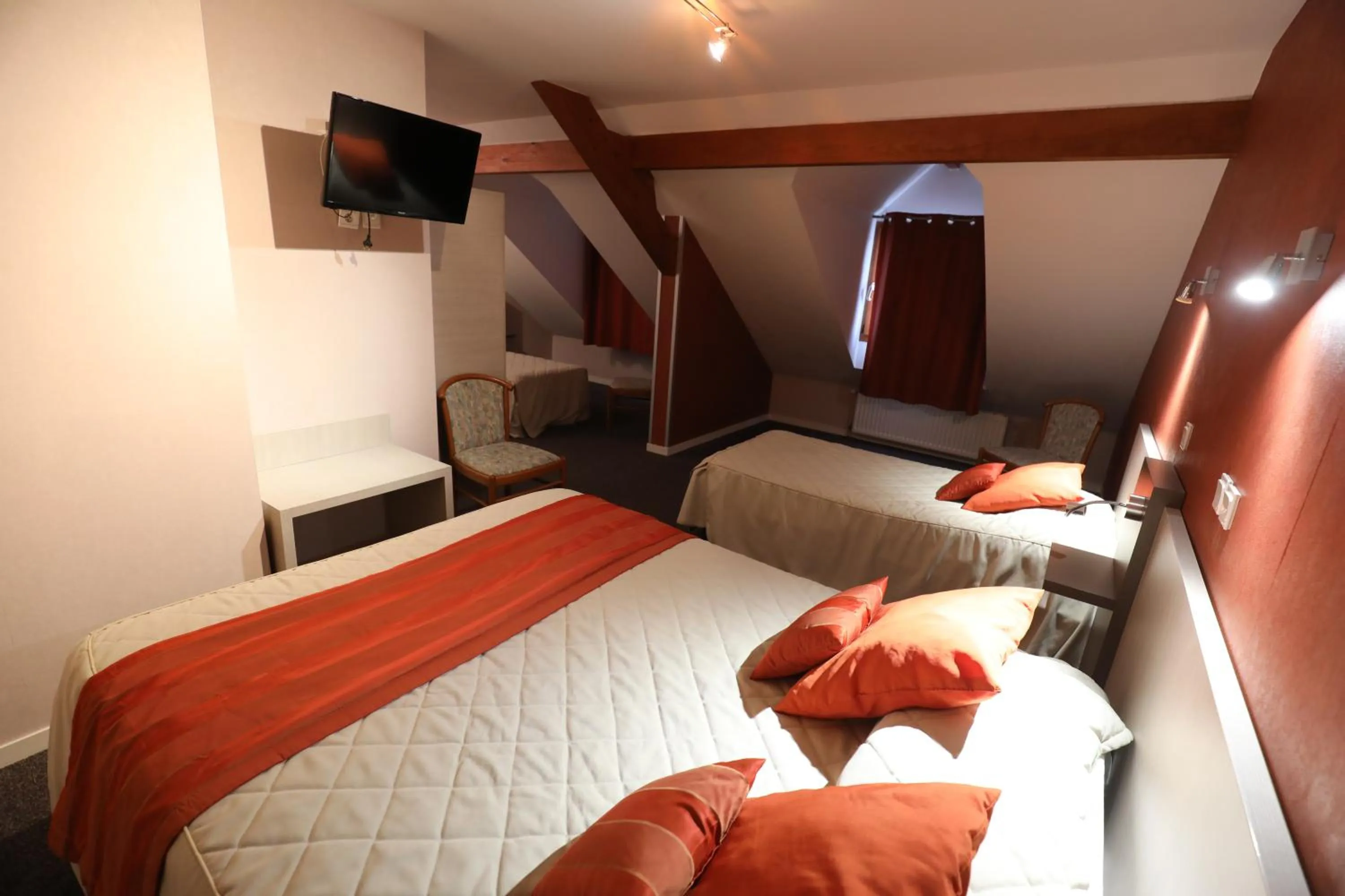 Bed in Logis Le Bourguignon