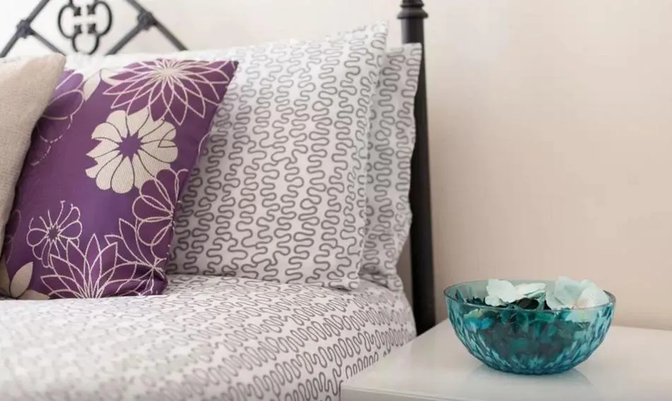 Bed in Home2Home-Rooms