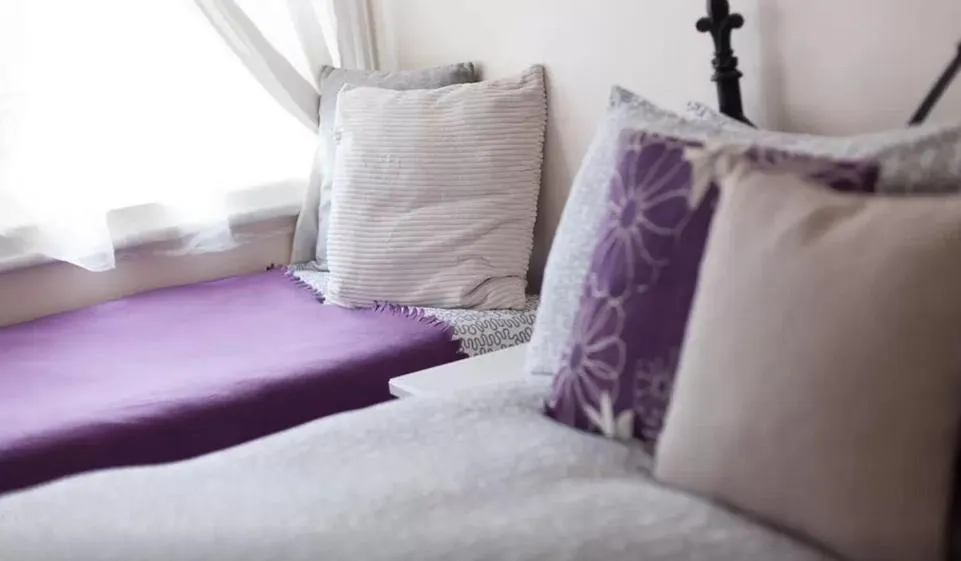 Bed in Home2Home-Rooms