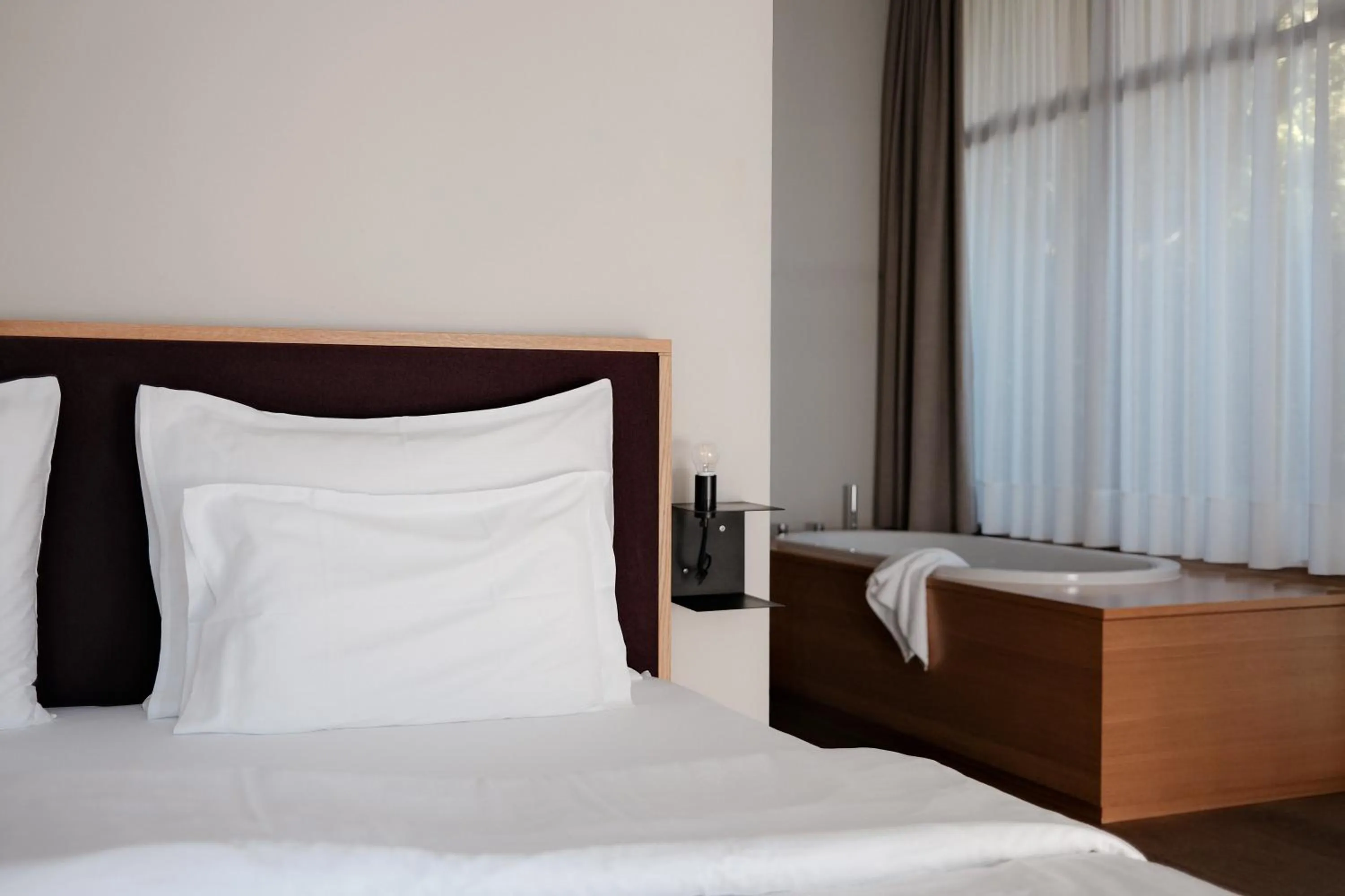 Bed in Hotel Schwarzschmied, a Member of Design Hotels