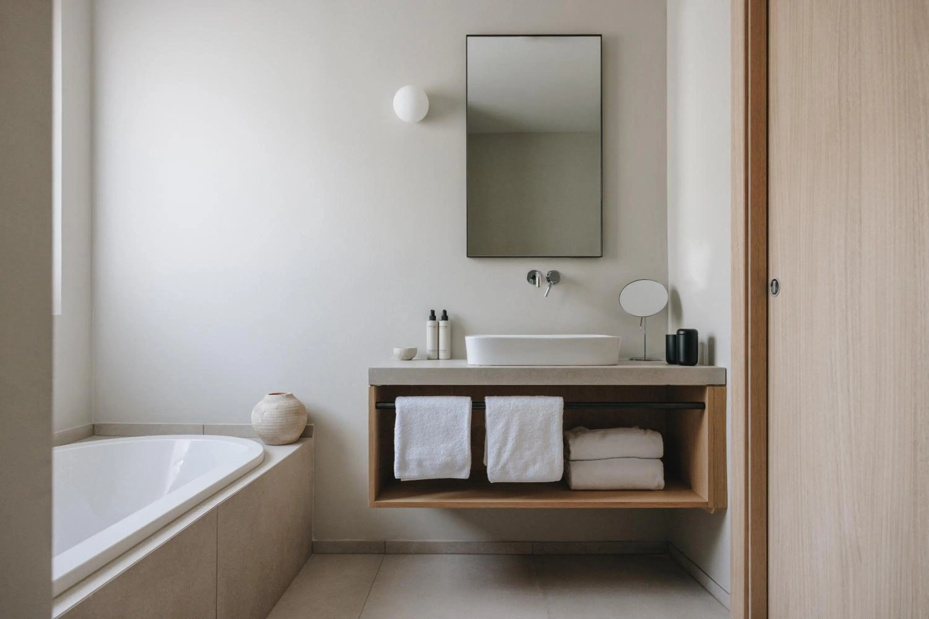 Bathroom, Bed in Hotel Schwarzschmied, a Member of Design Hotels