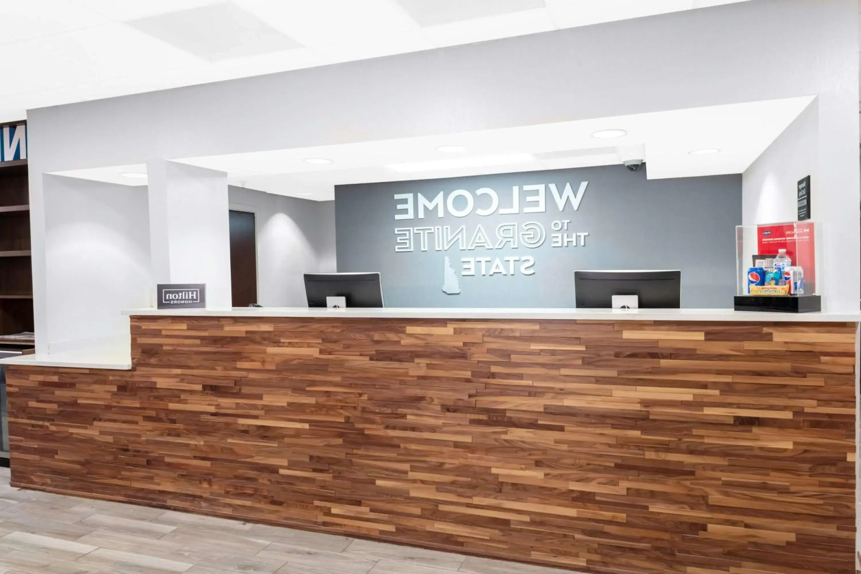 Lobby or reception in Hampton Inn by Hilton Concord/Bow Lobby or reception in Hampton Inn by Hilton Concord/Bow