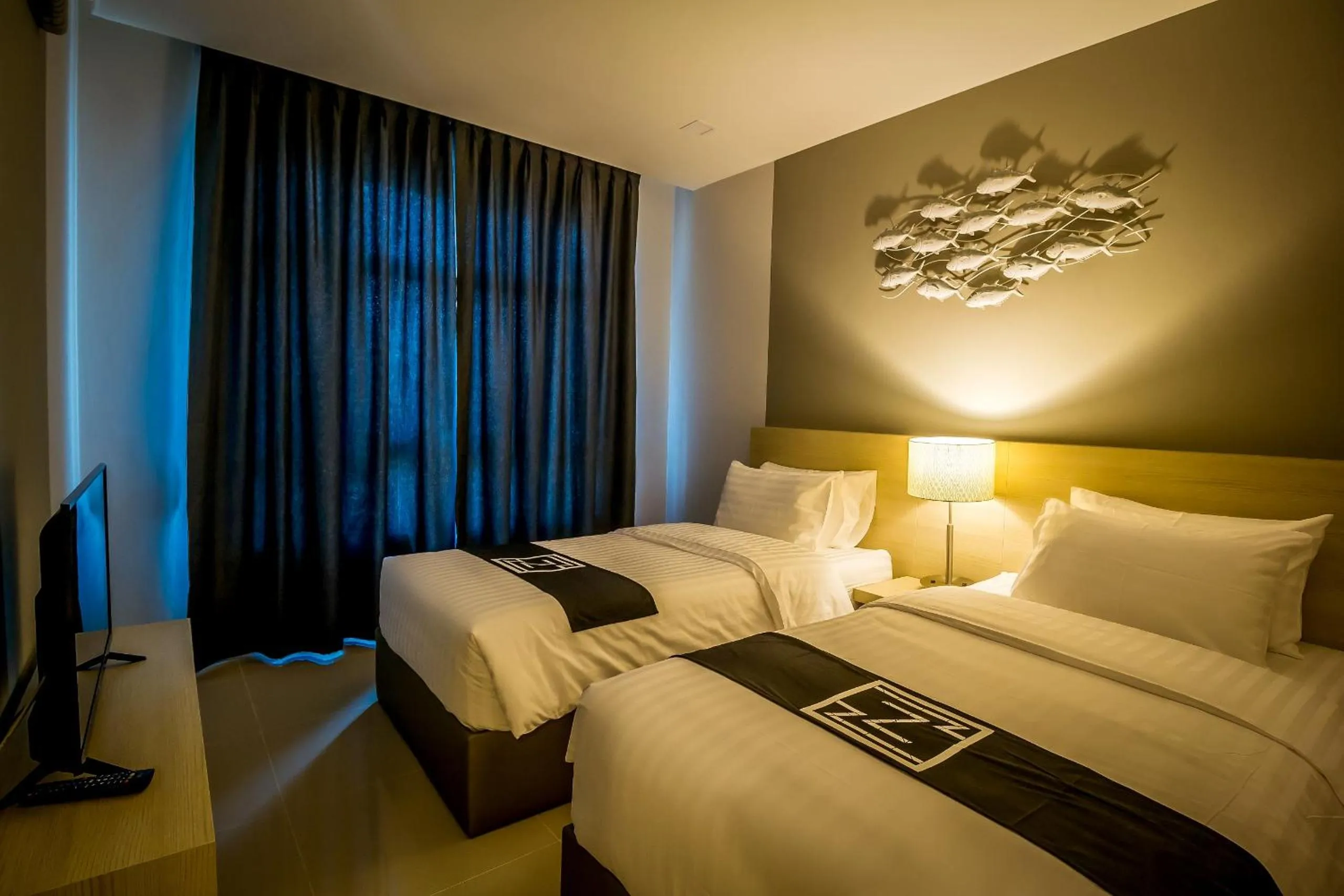 Bed in Triple Z Hotel