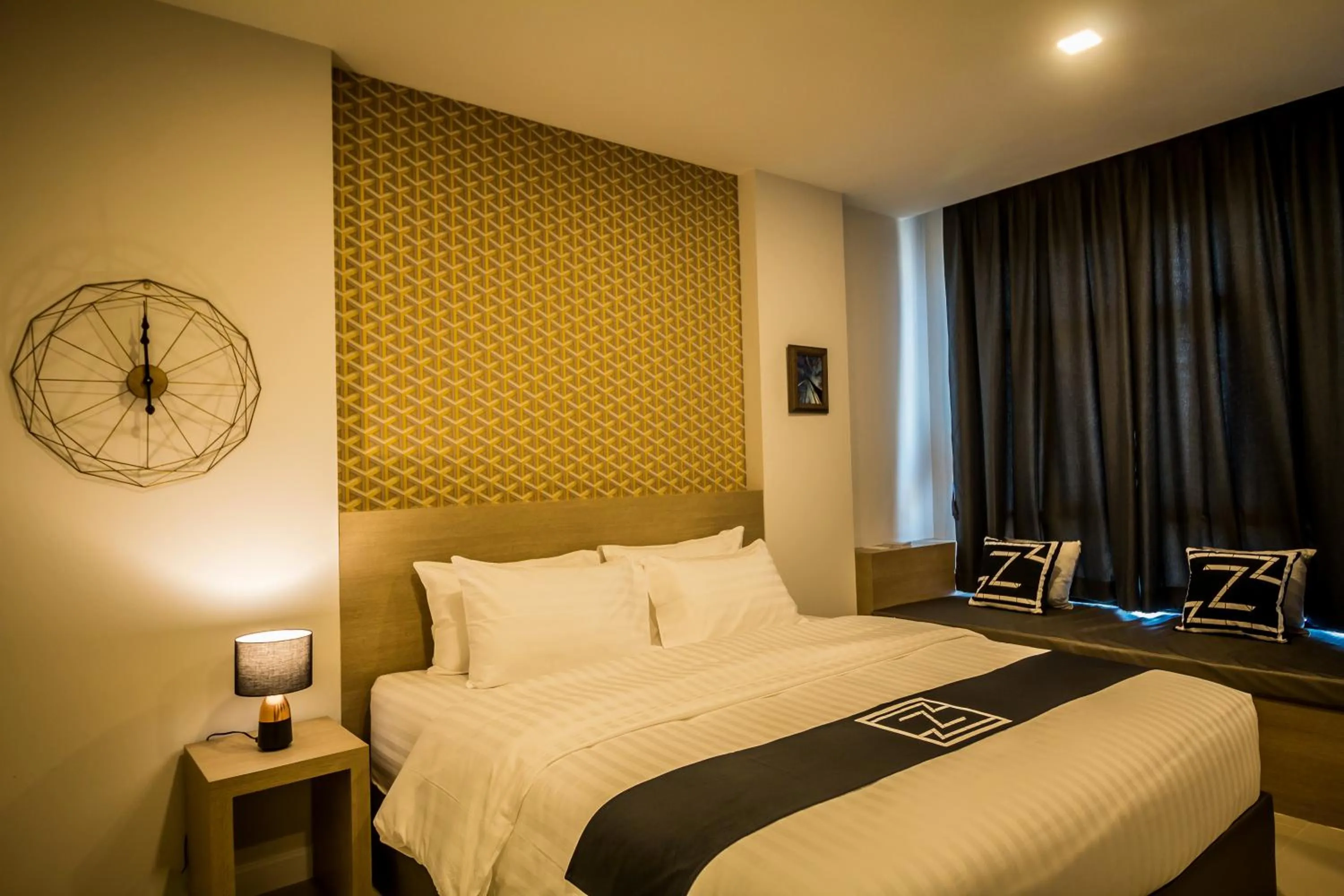 Bed in Triple Z Hotel