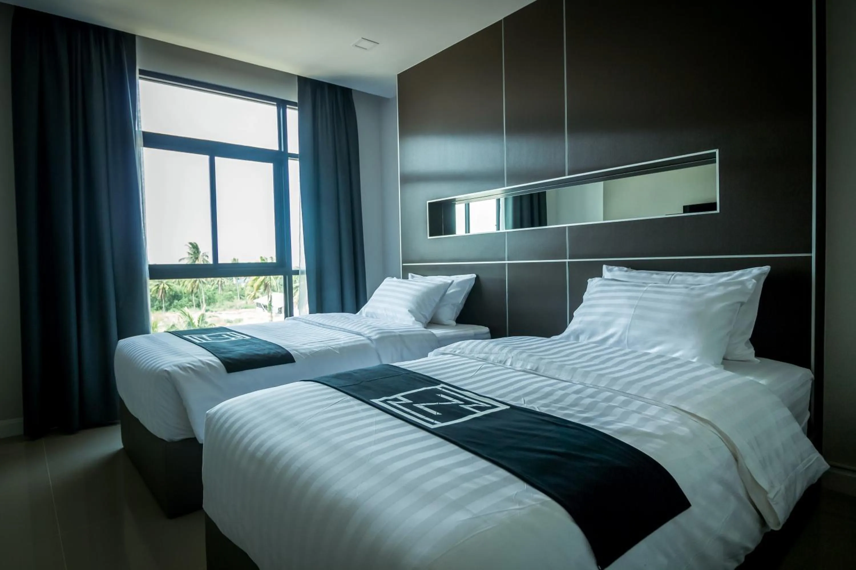 Bed in Triple Z Hotel