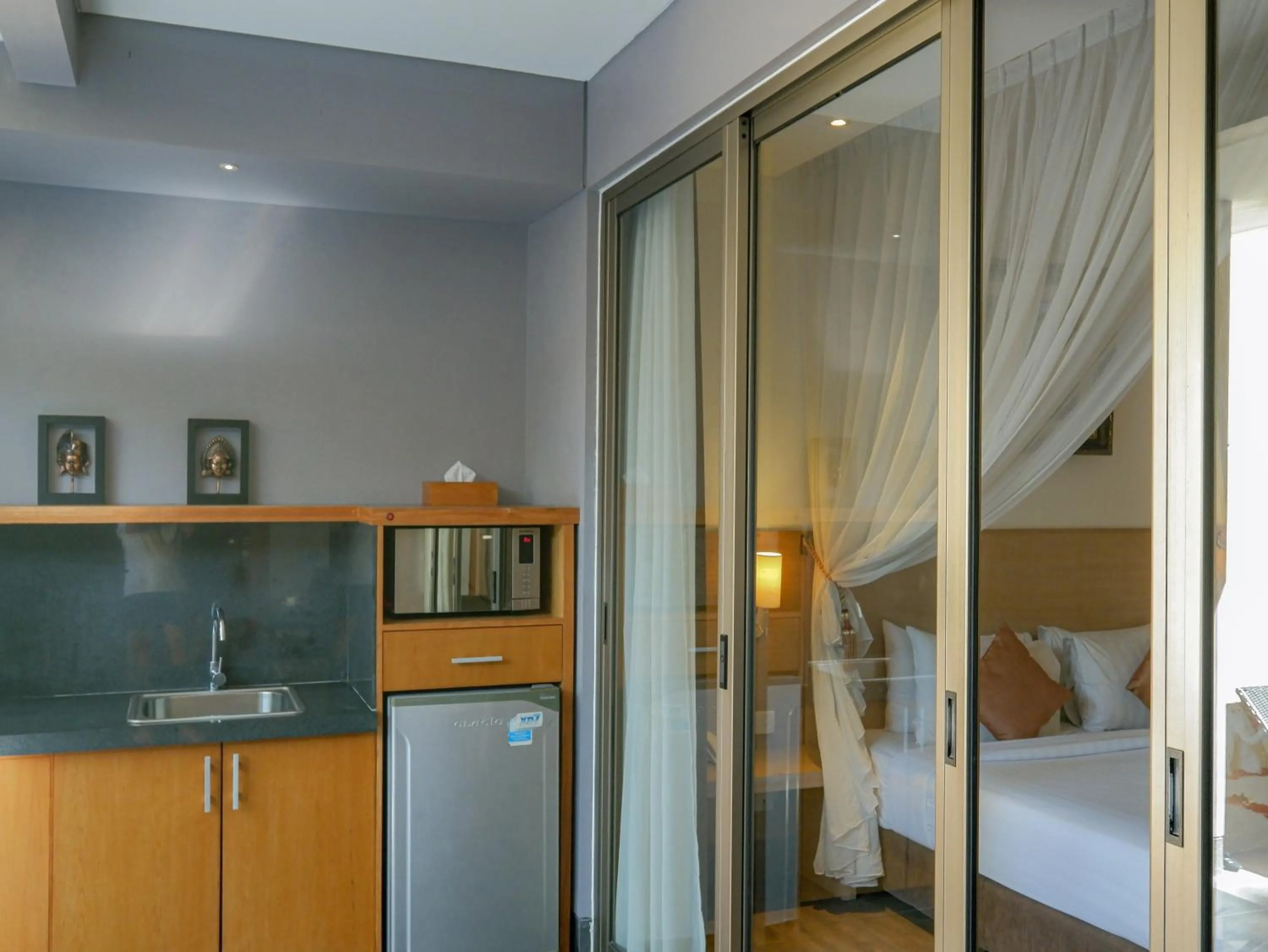 Kitchen or kitchenette, Bed in Lasanti Villas Seminyak
