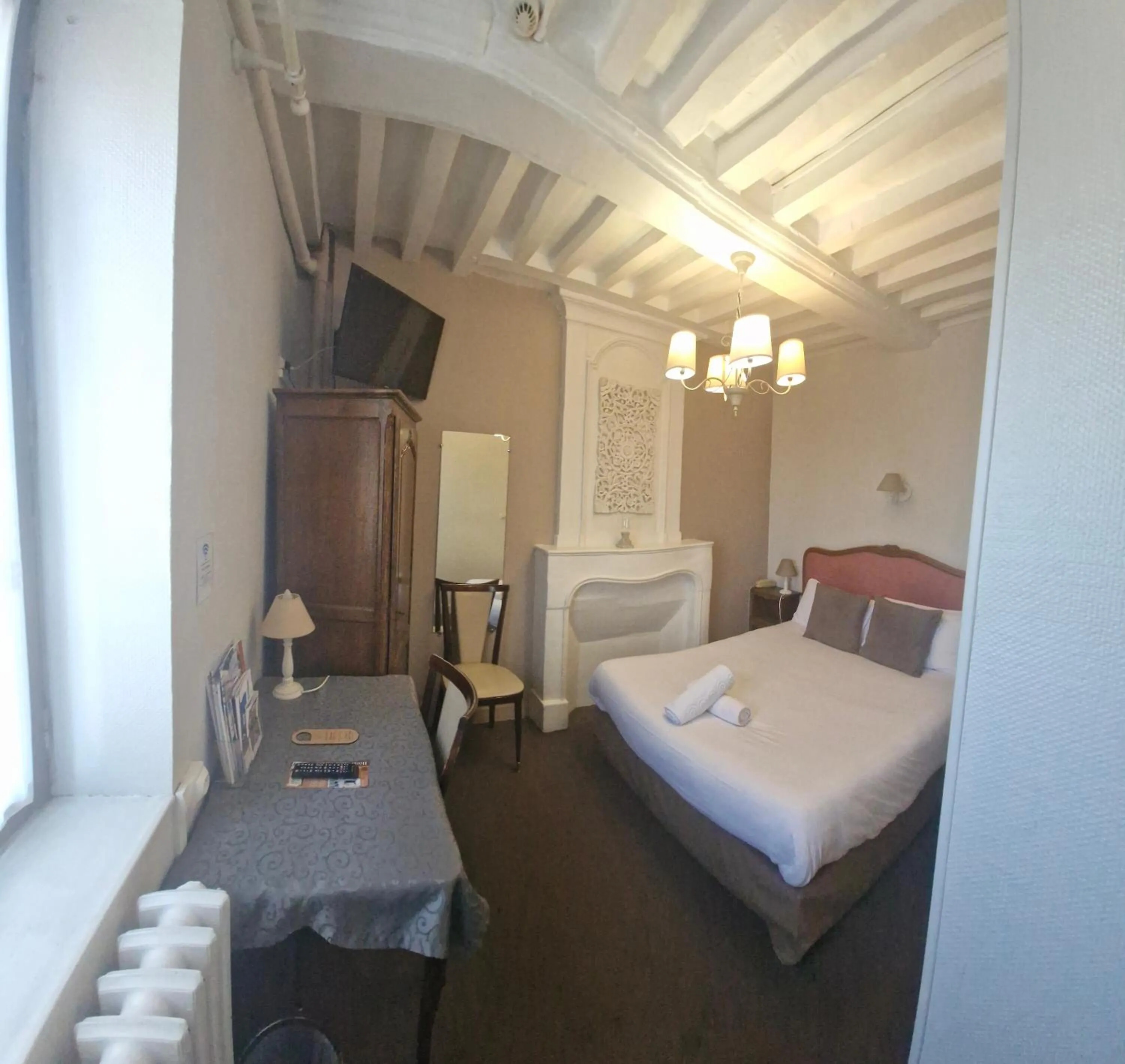 Photo of the whole room, Bed in Hotel Saint Etienne