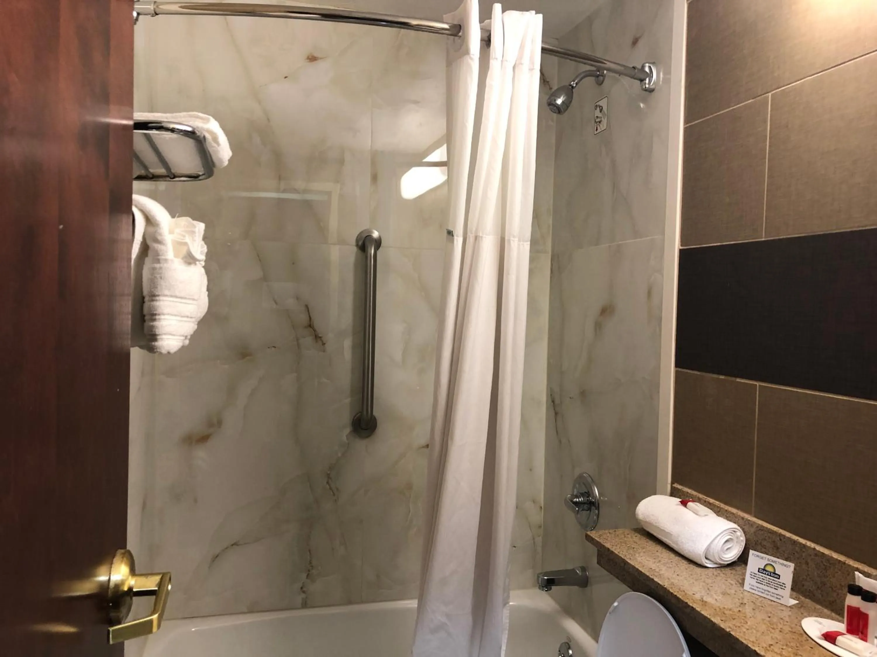 Bathroom in Days Inn by Wyndham Brooklyn