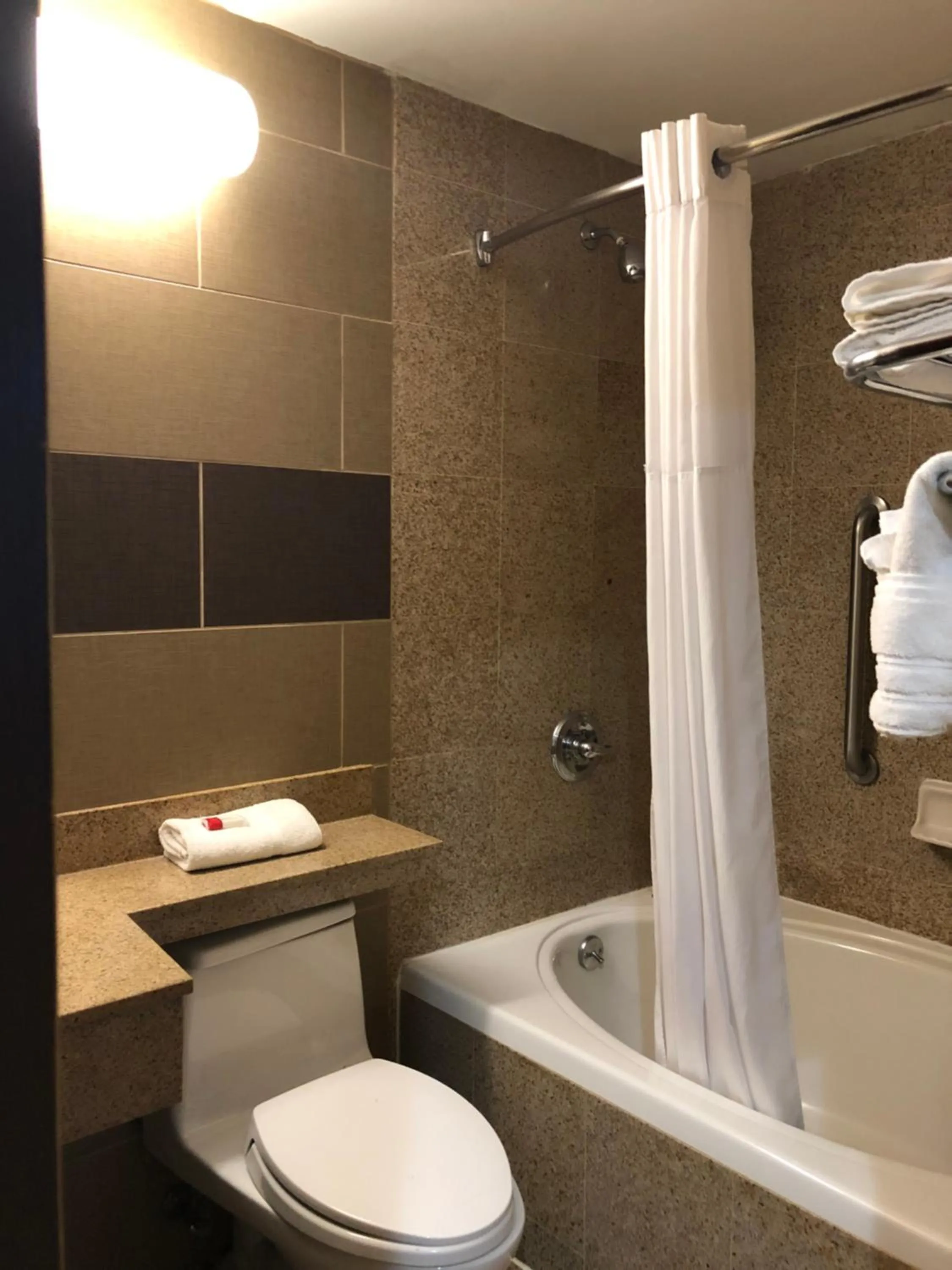 Bathroom in Days Inn by Wyndham Brooklyn