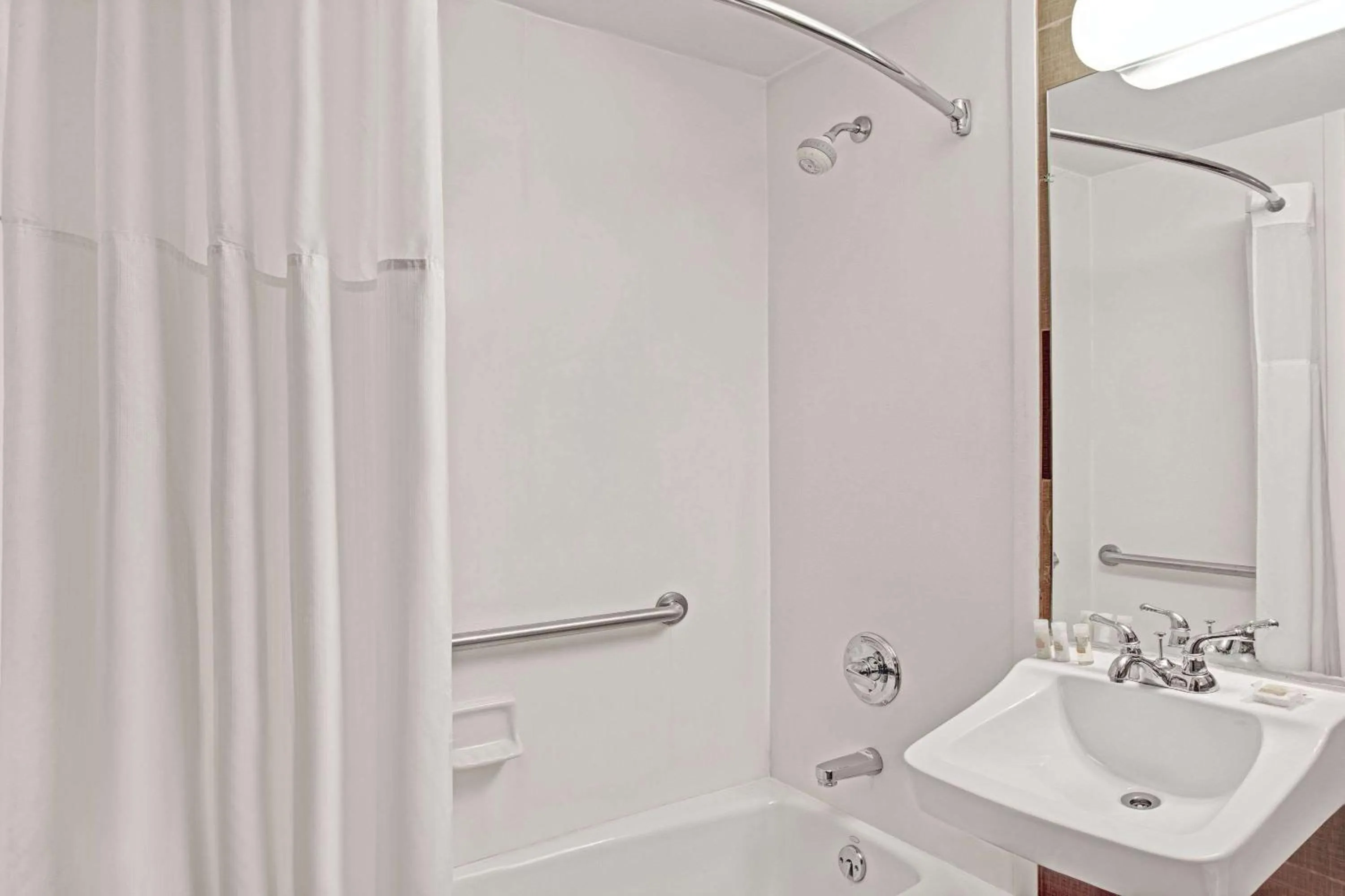 Bathroom in Days Inn by Wyndham Brooklyn