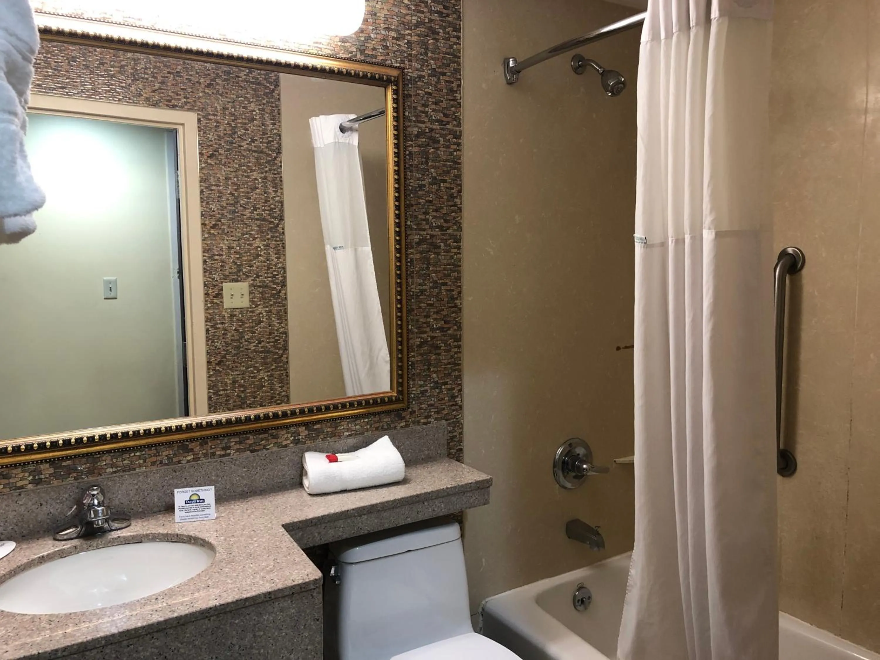 Bathroom in Days Inn by Wyndham Brooklyn