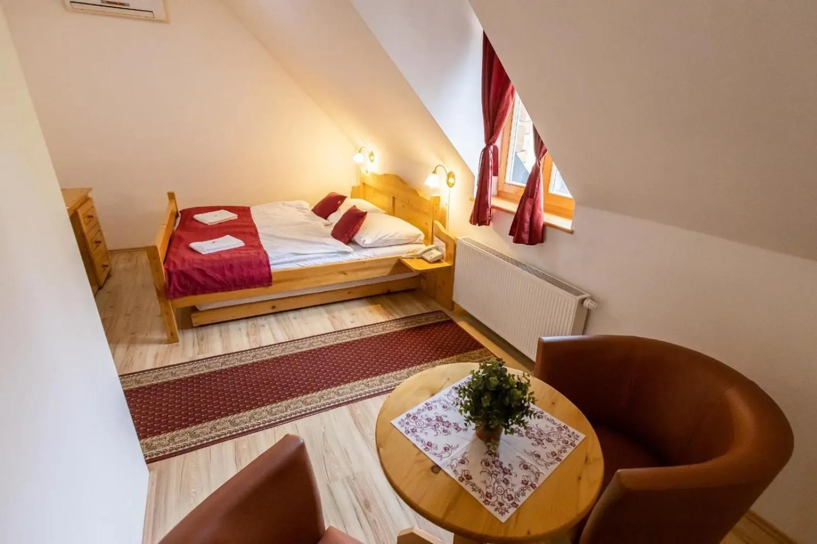 Living room, Bed in Hotel Koliba