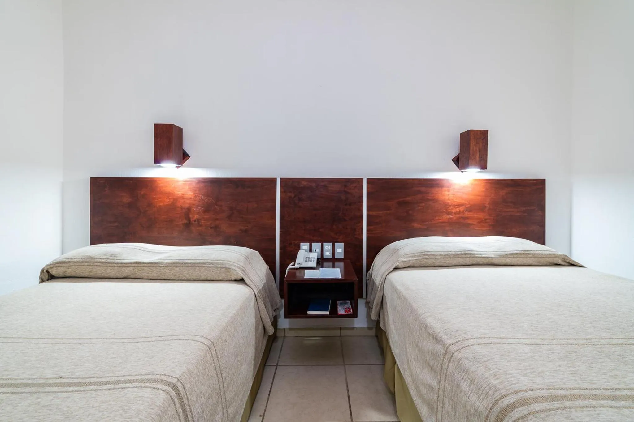 Bed in Hotel Castillo Huatulco & Beach Club