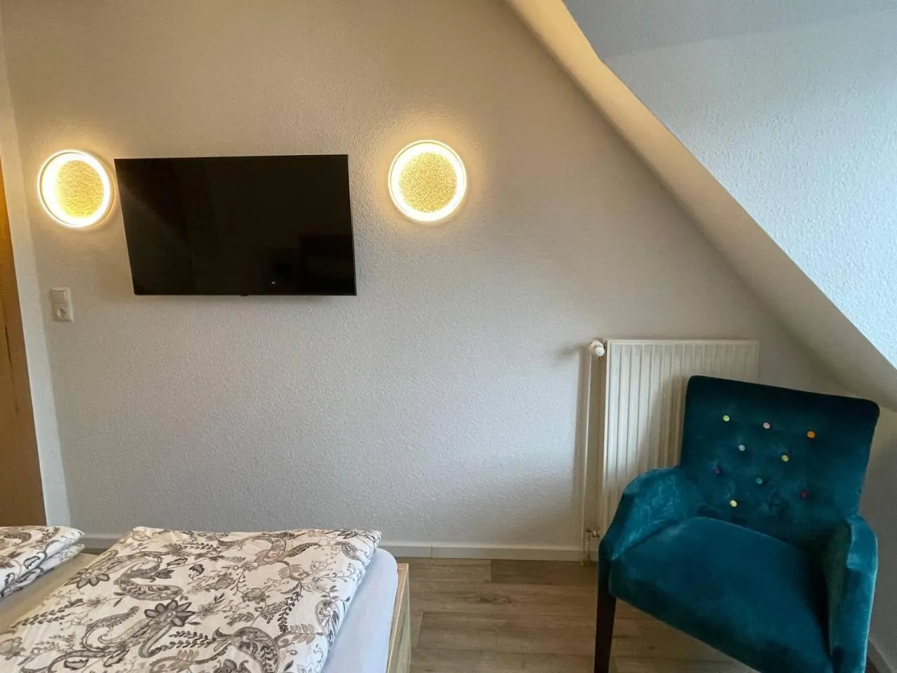 Communal lounge/ TV room, Bed in Hotel Deichvoigt