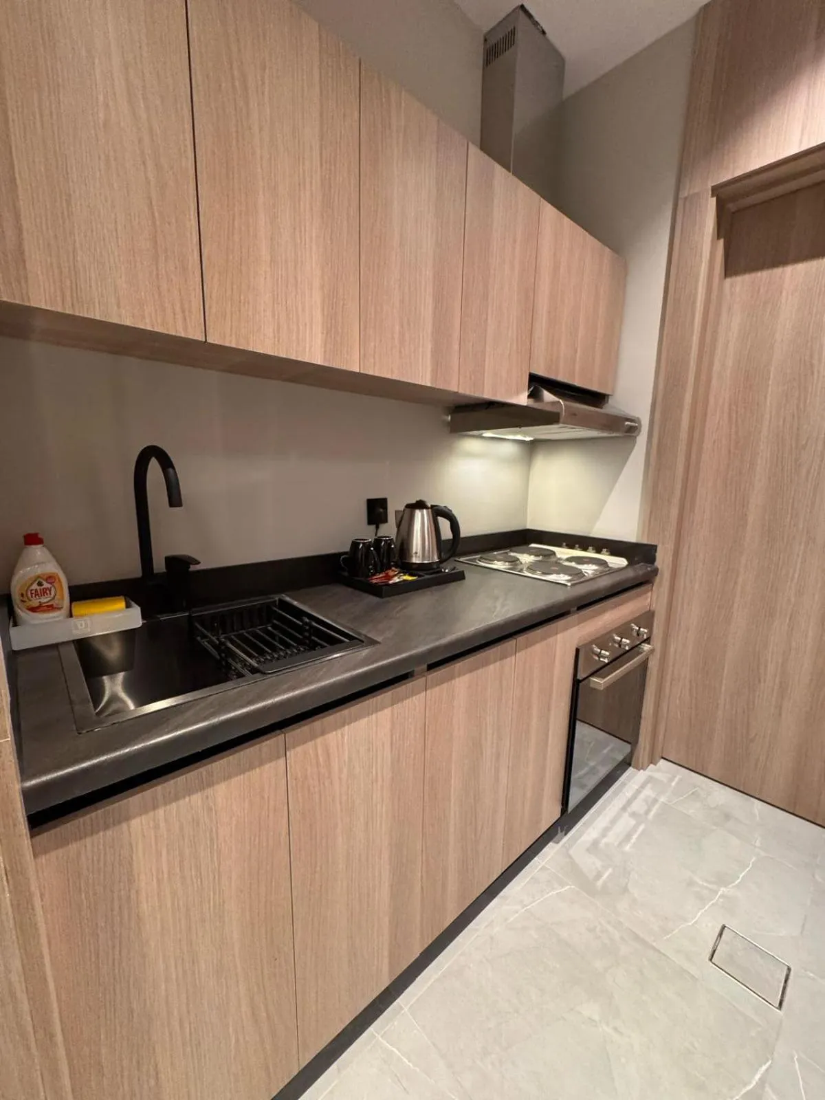 Kitchen or kitchenette in Manazel Aldiafah serviced Apartments AlSulymaniyah