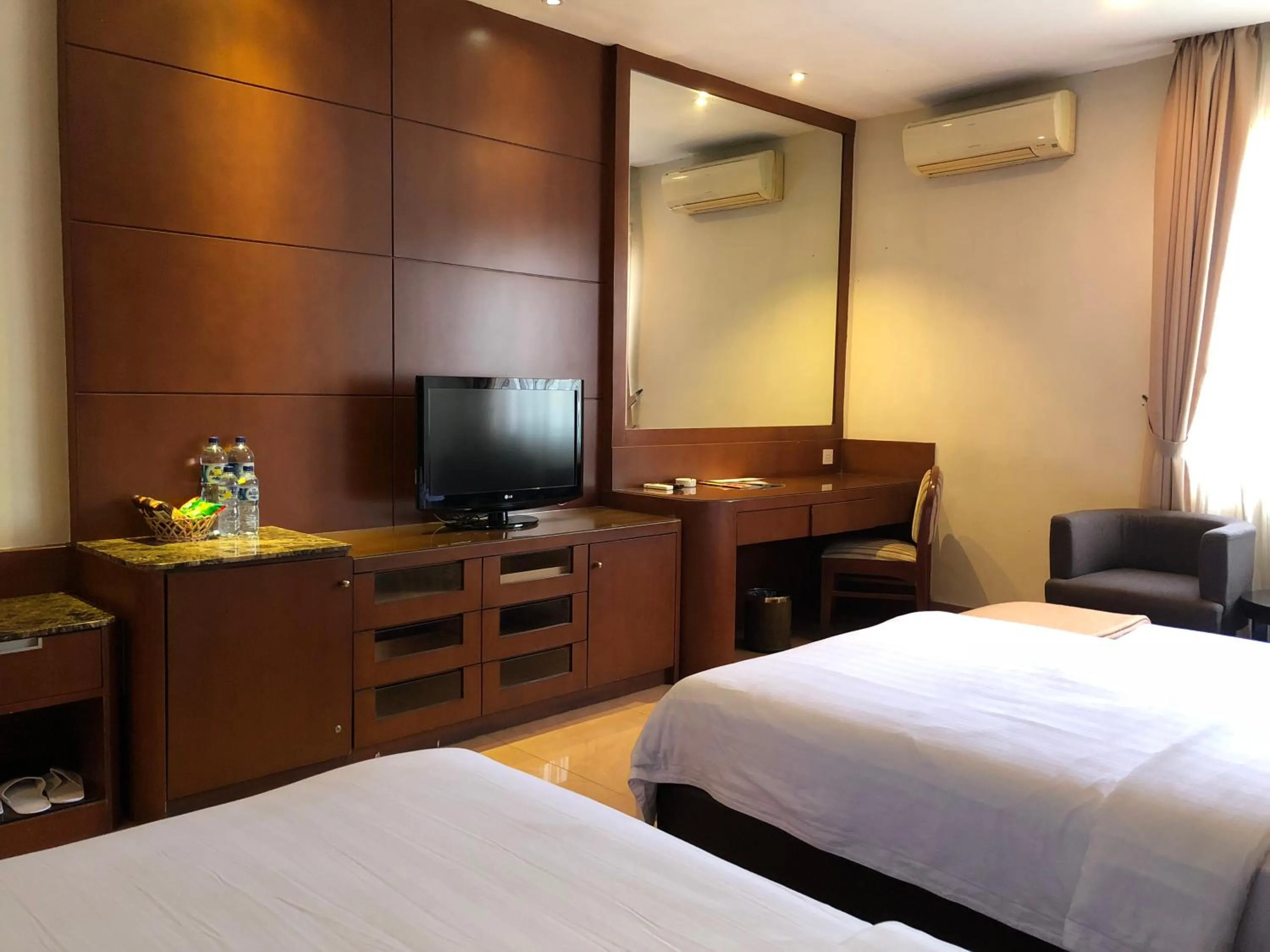 Bed in Grand Sakura Hotel