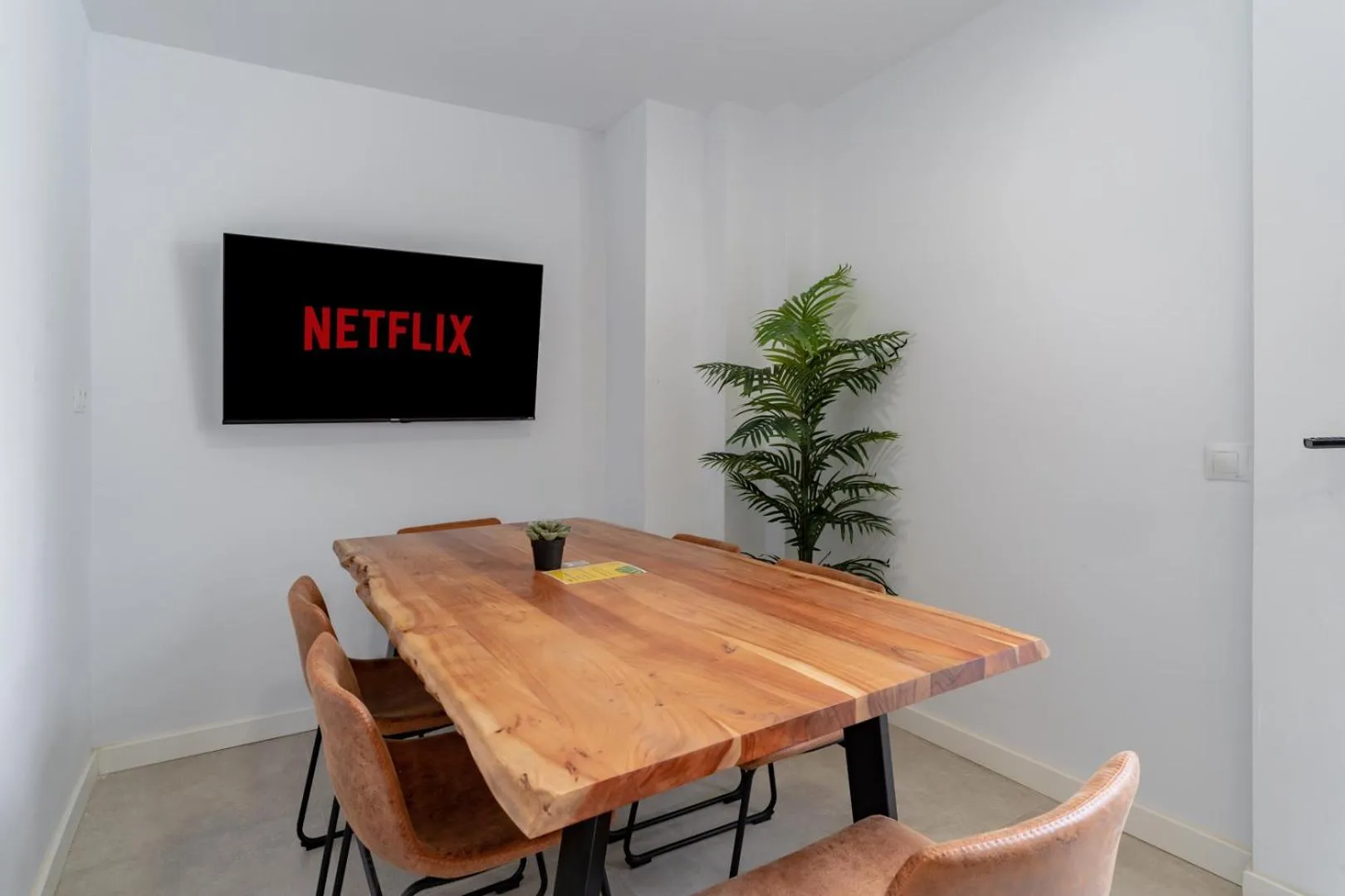 Communal lounge/ TV room in The Urban Jungle Hostel