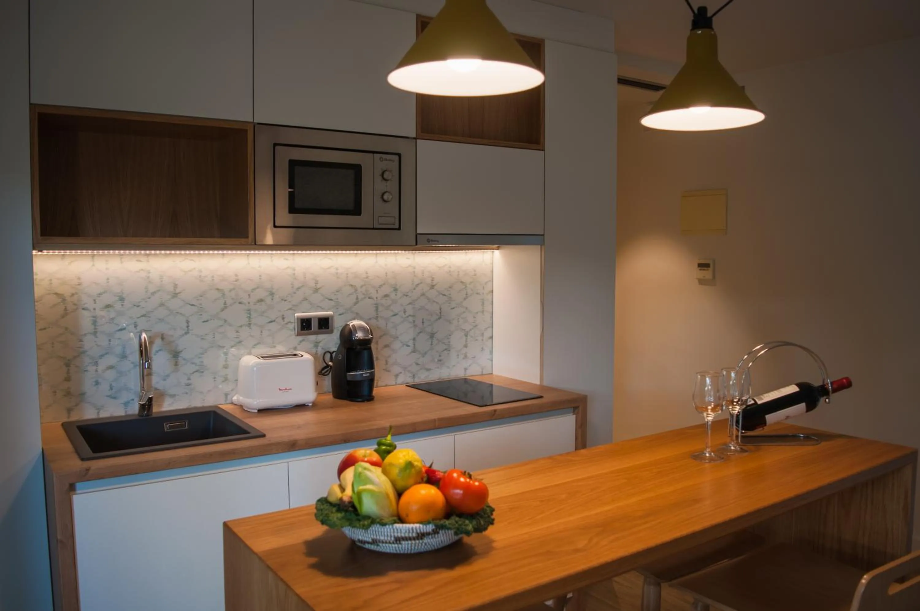 Kitchen or kitchenette in Apartamentos Porta Coeli