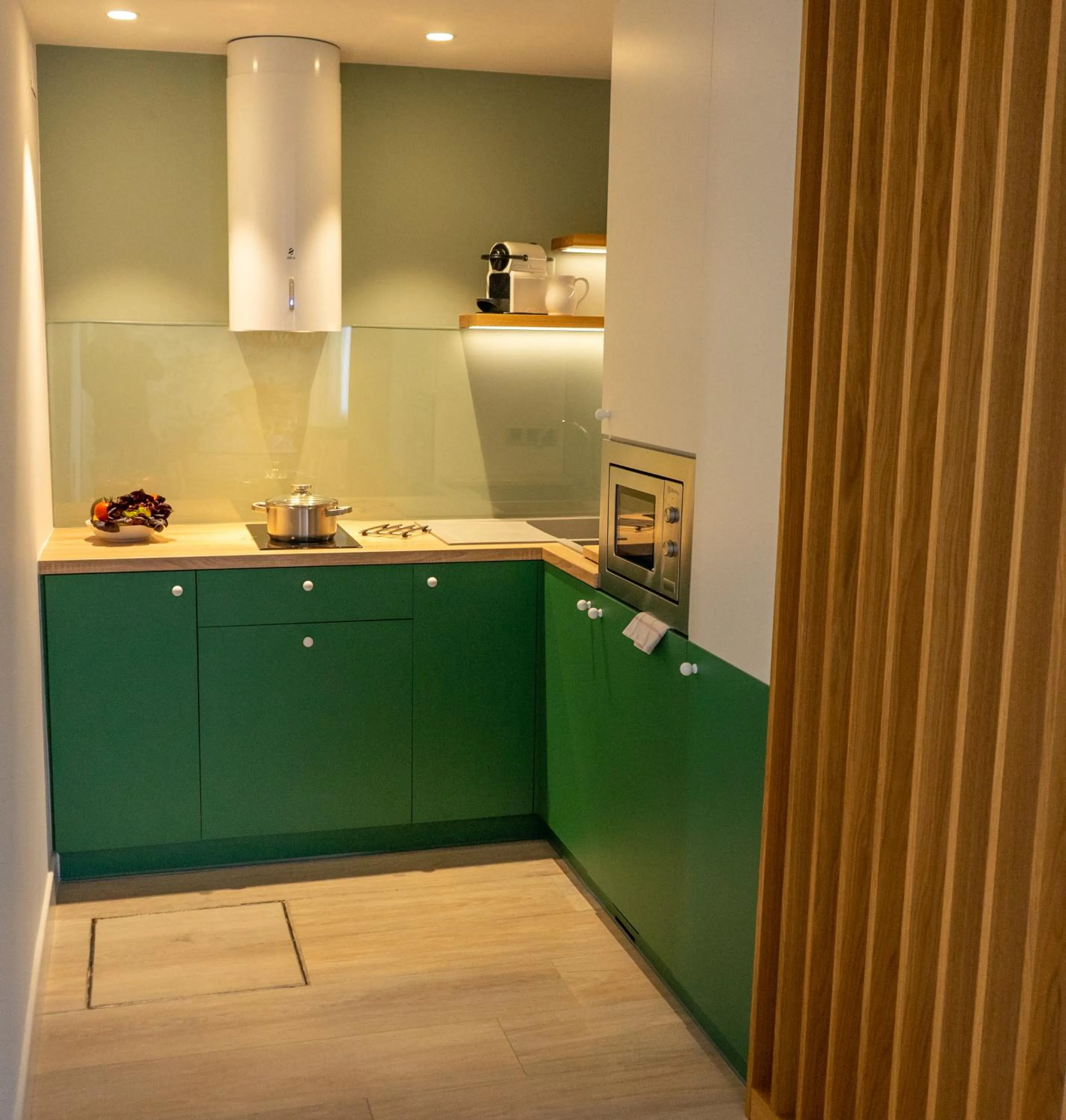 Kitchen or kitchenette in Apartamentos Porta Coeli