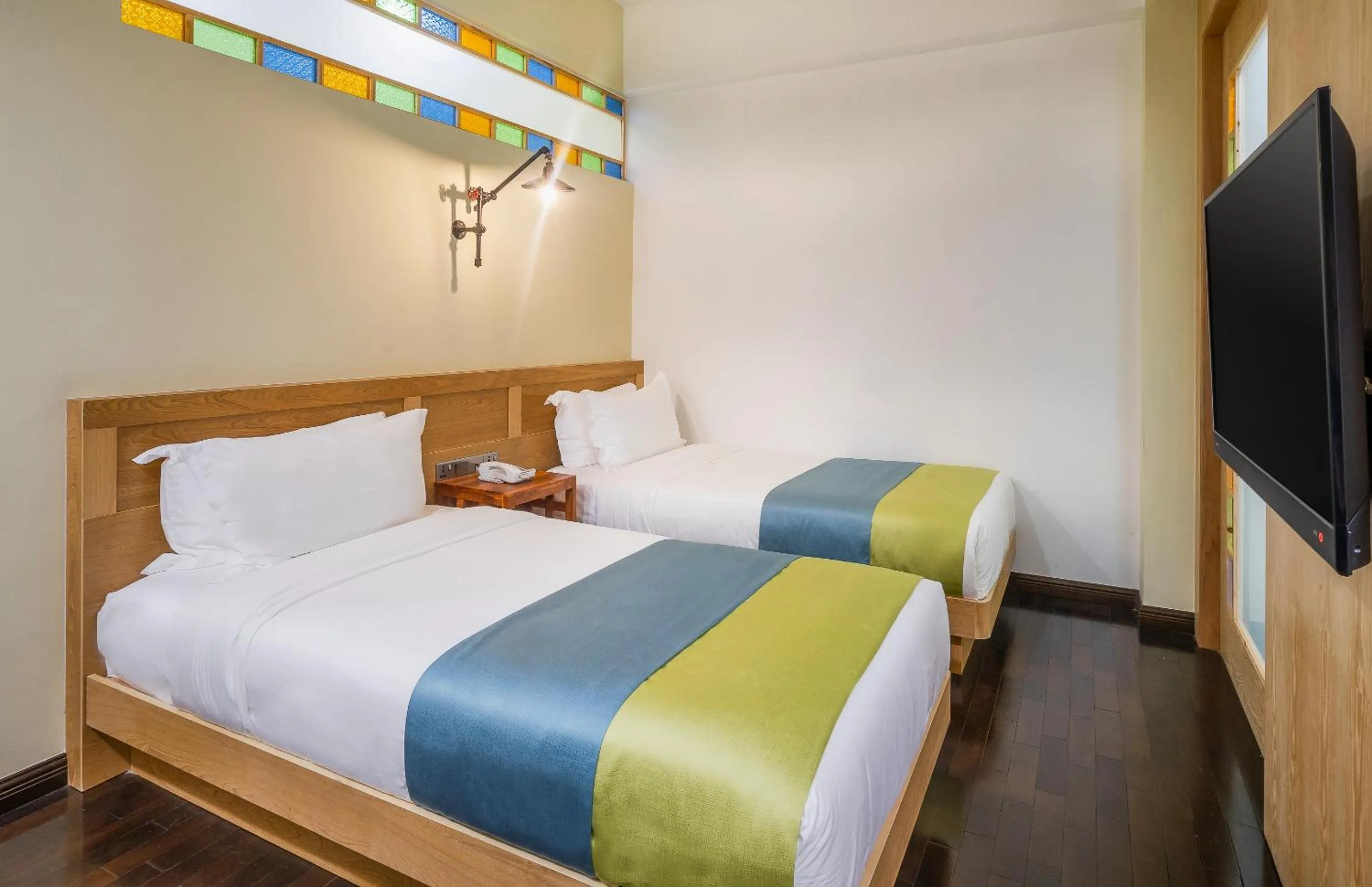 Communal lounge/ TV room, Bed in Treasures Hotel and Suites