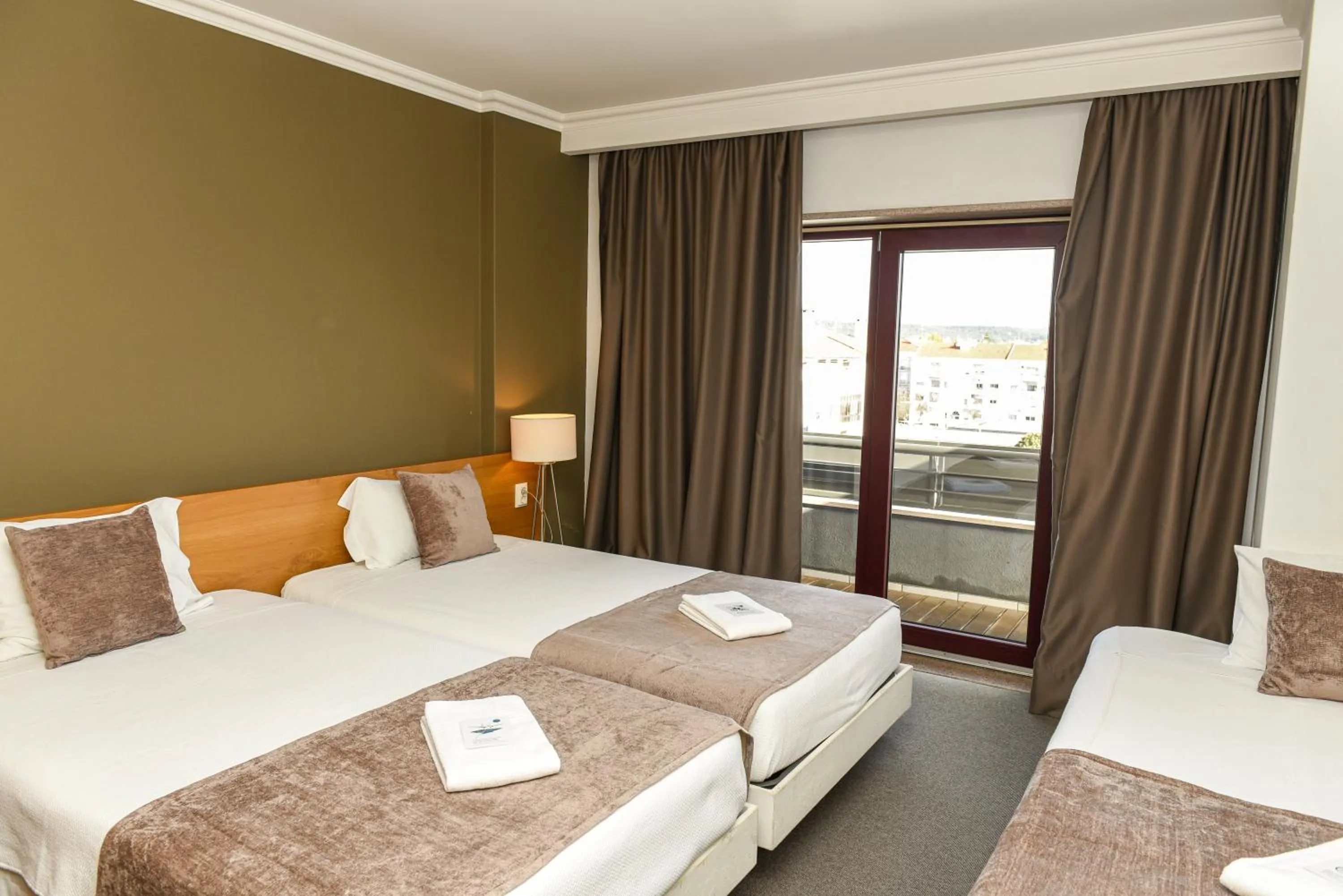 Bed in Dom Joao Hotel