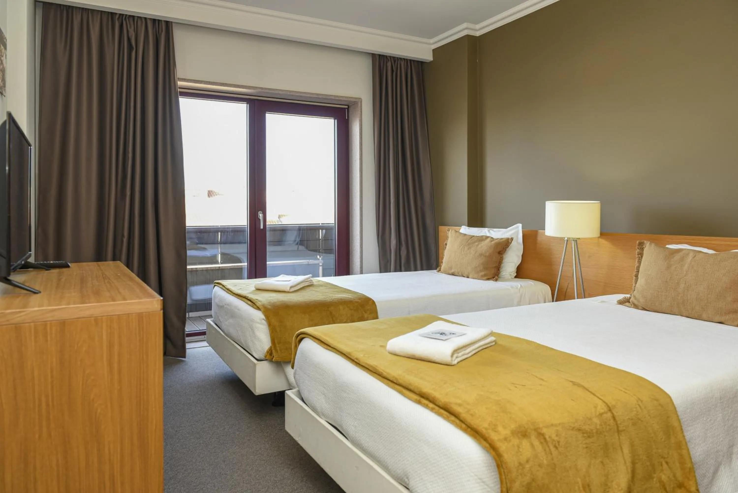 Bed in Dom Joao Hotel