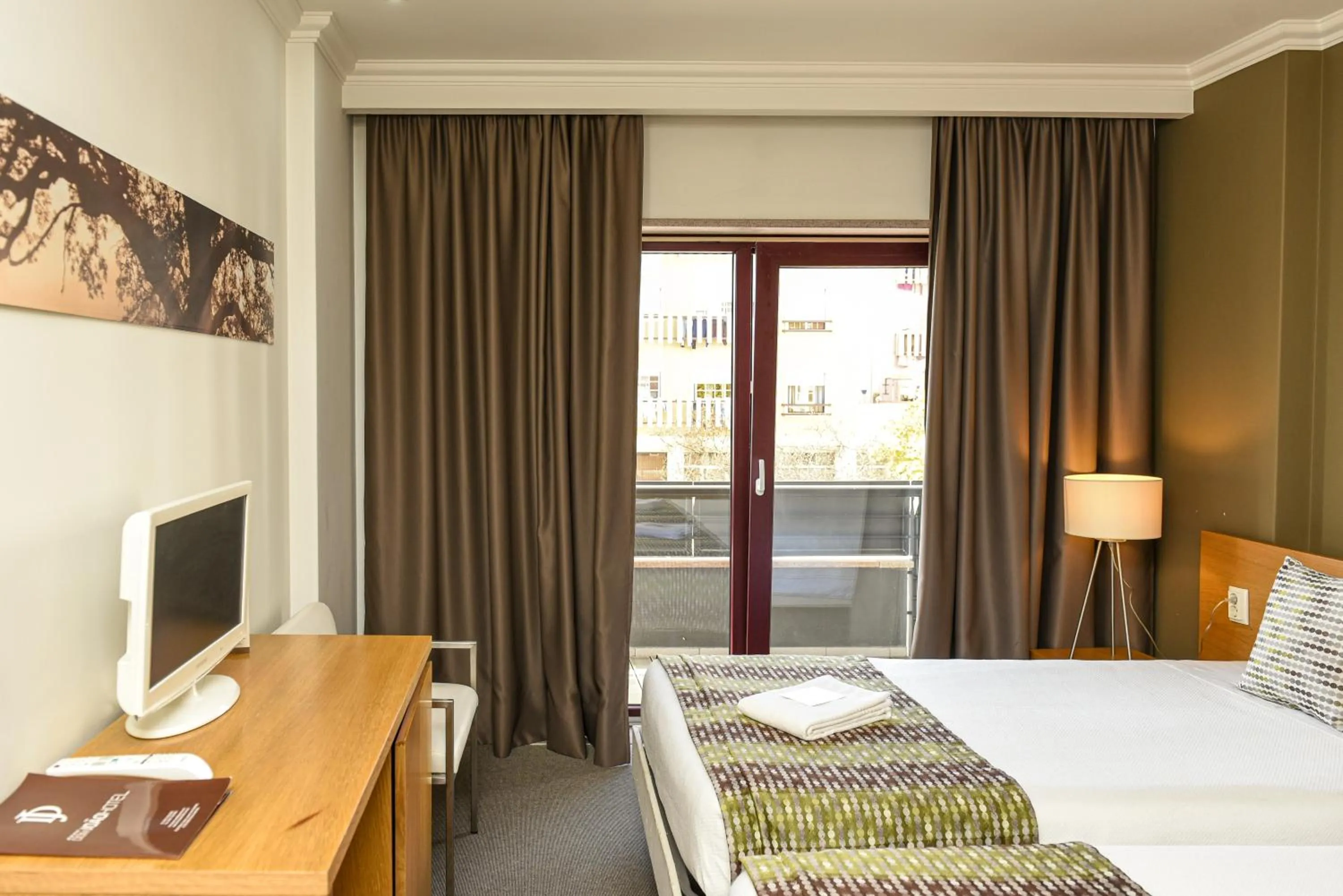 Bed in Dom Joao Hotel