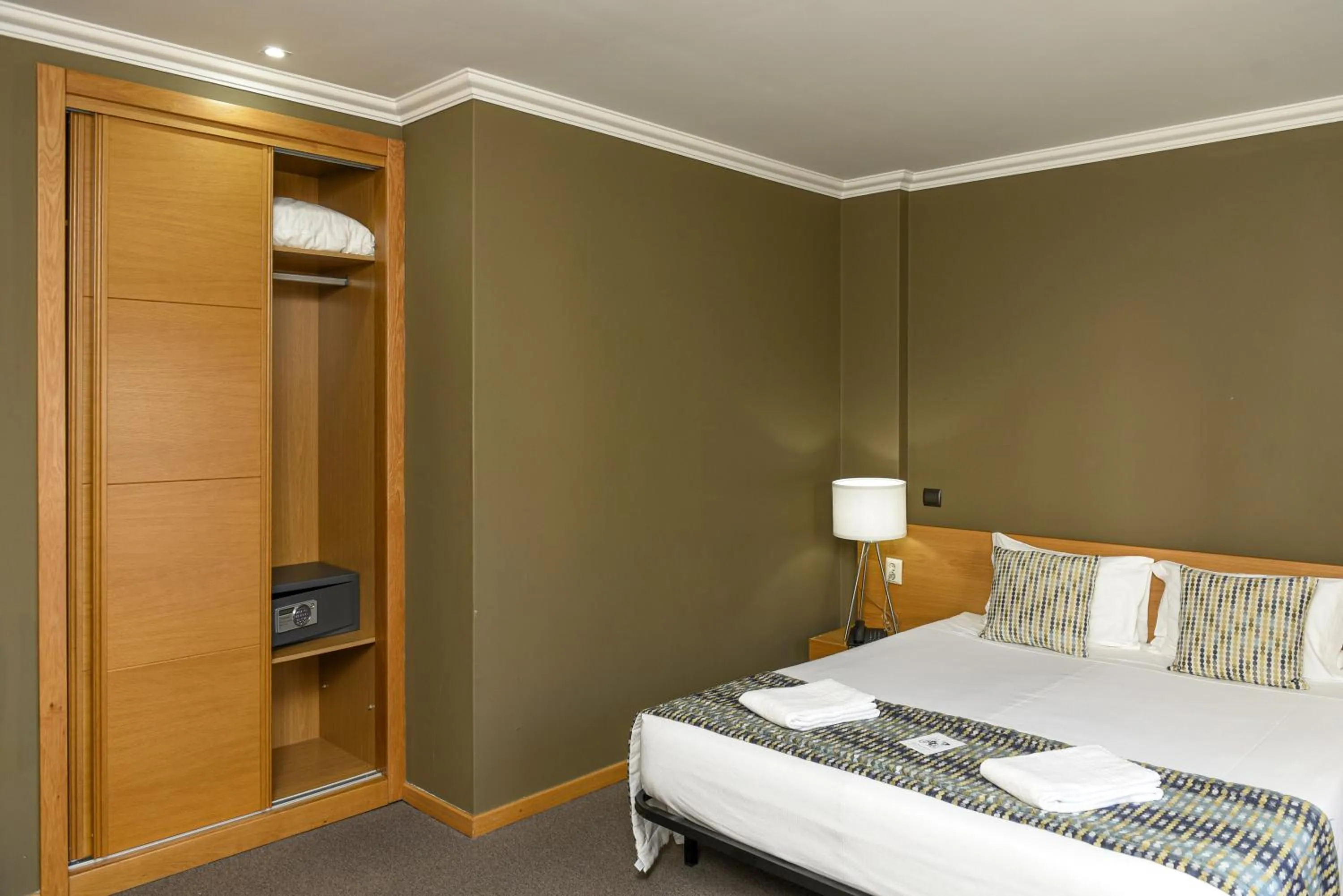 Bed in Dom Joao Hotel