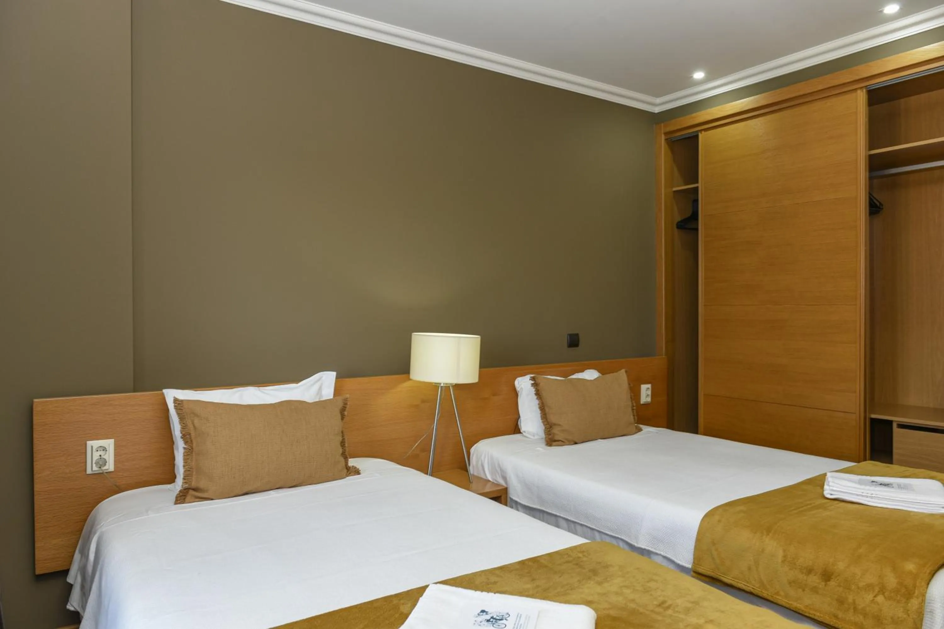 Bed in Dom Joao Hotel