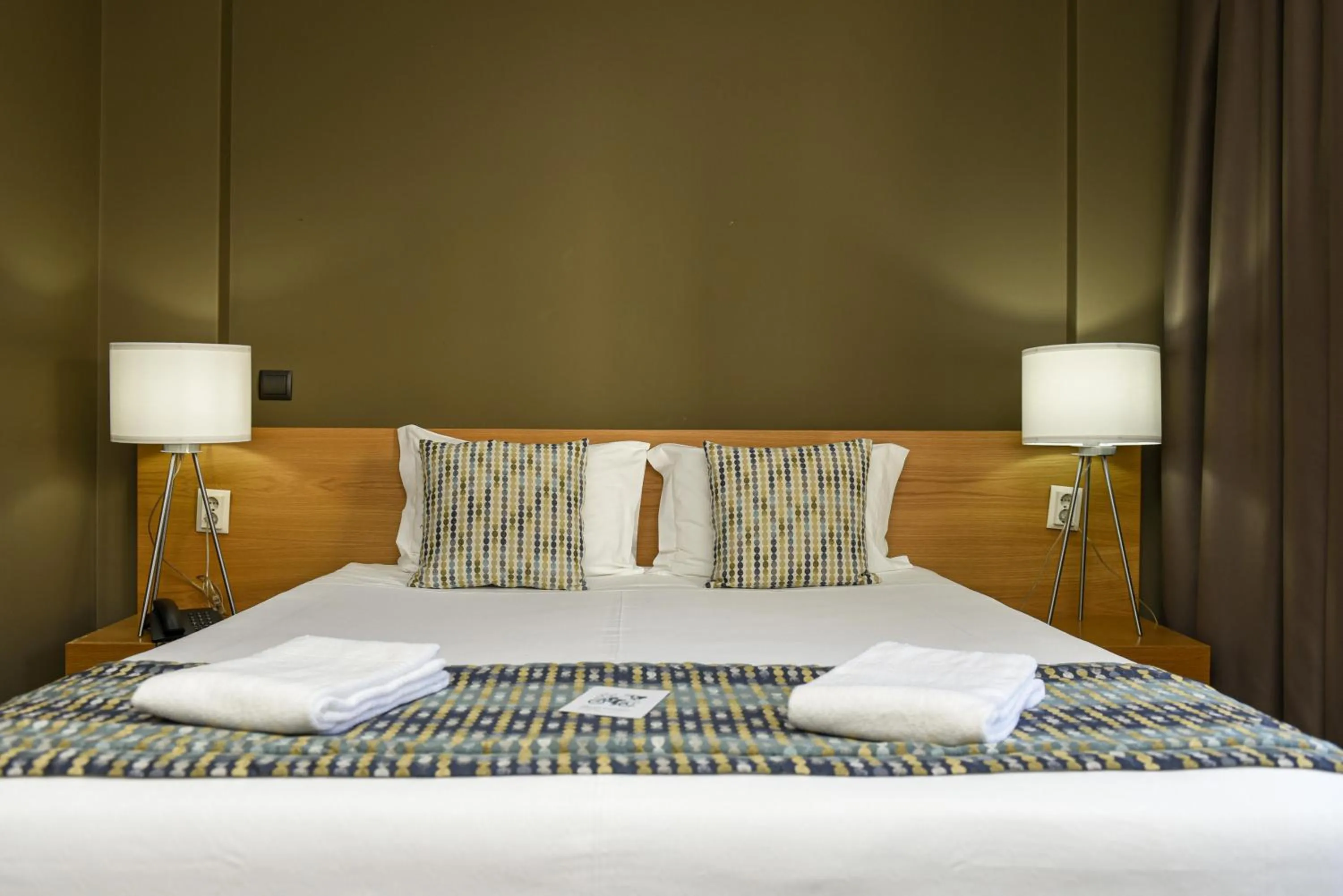 Bed in Dom Joao Hotel