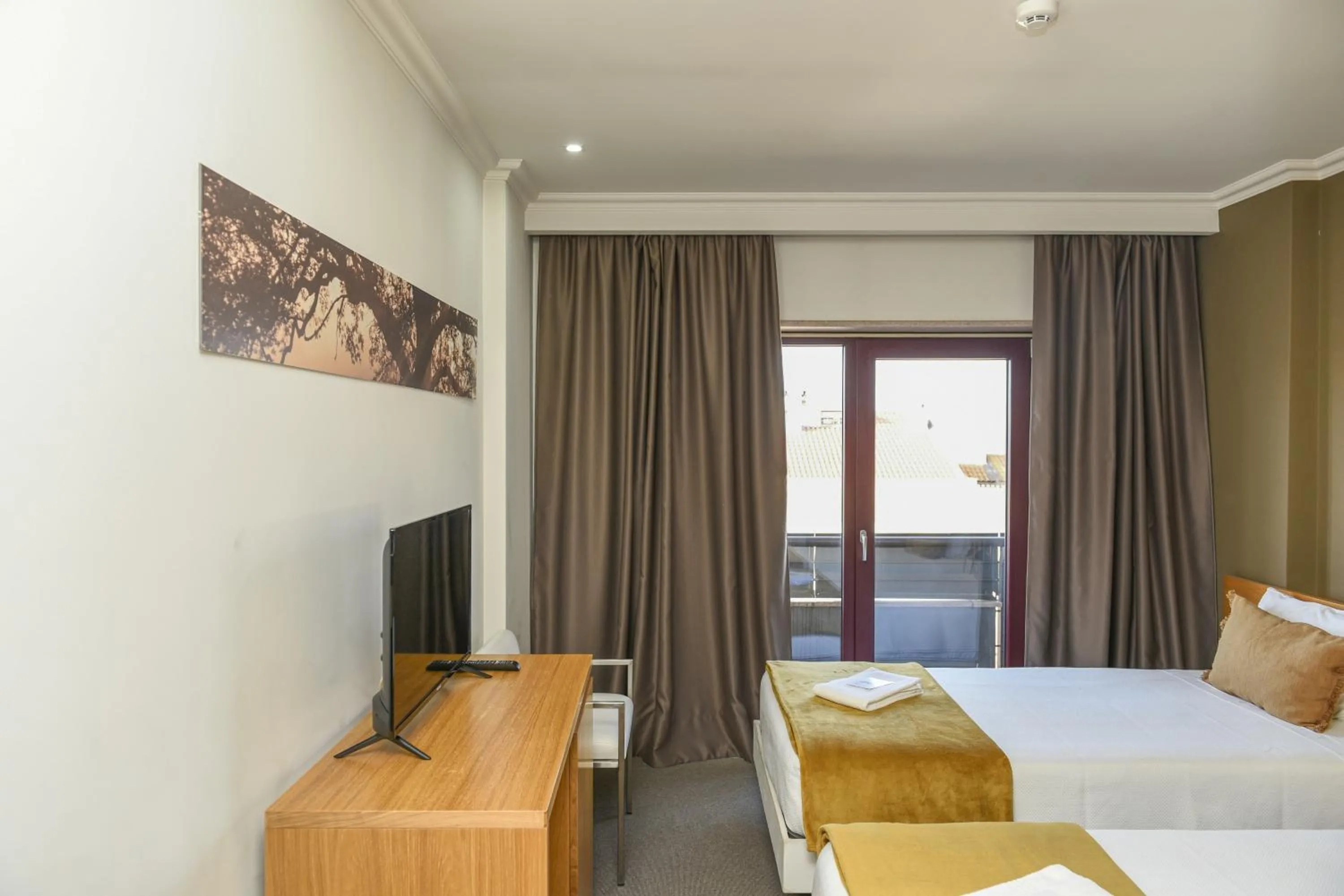 Bed in Dom Joao Hotel