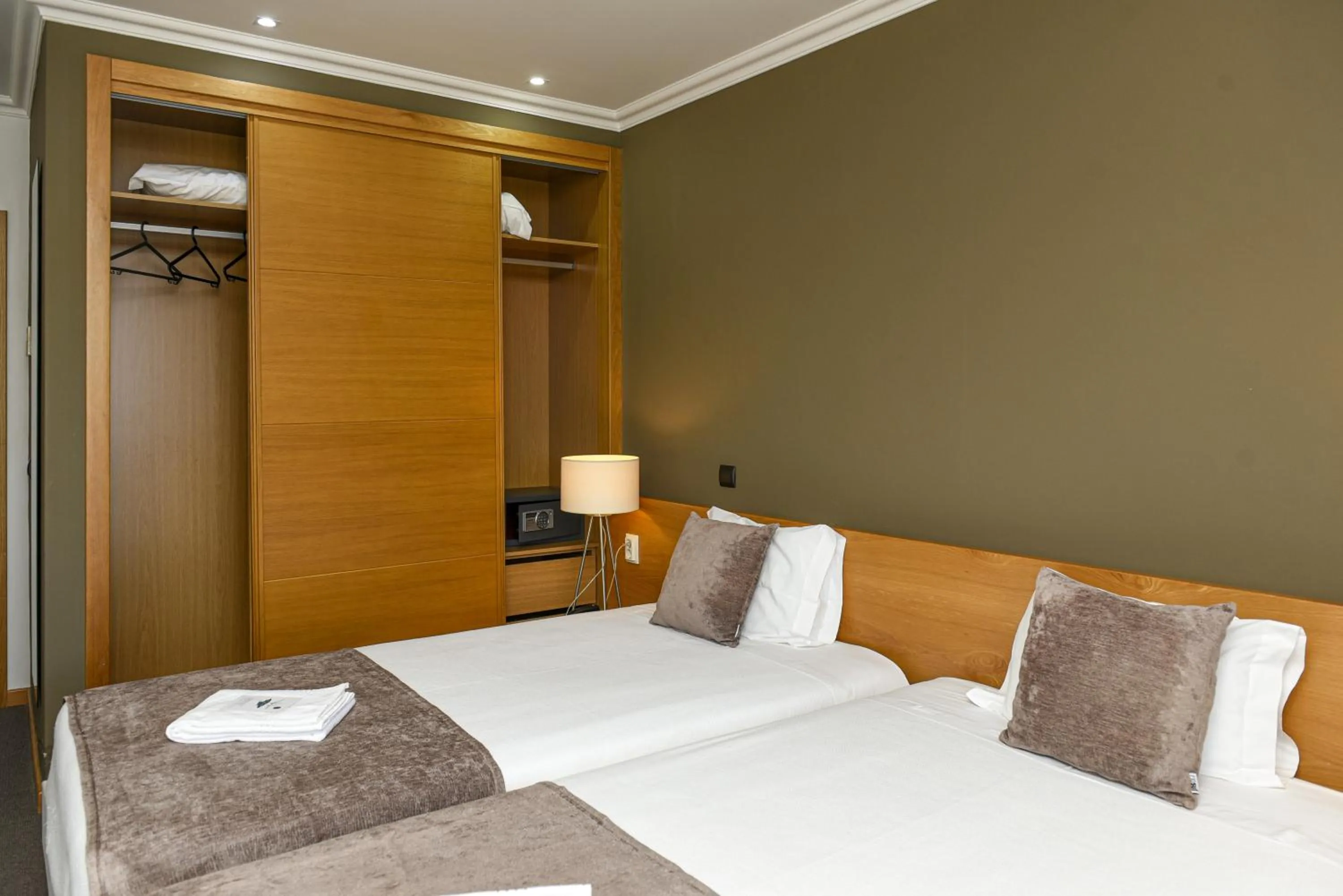 Bed in Dom Joao Hotel