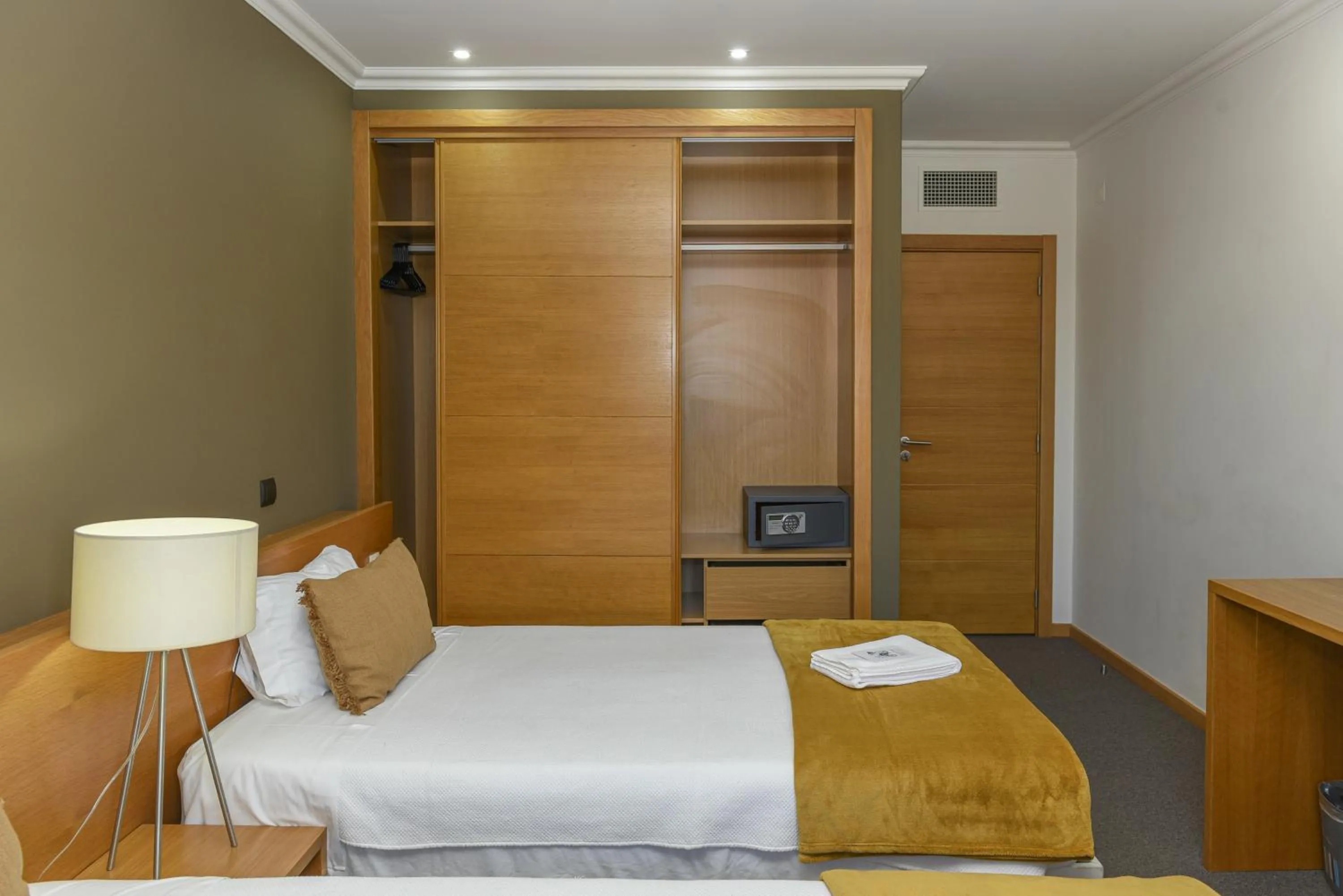 Bed in Dom Joao Hotel